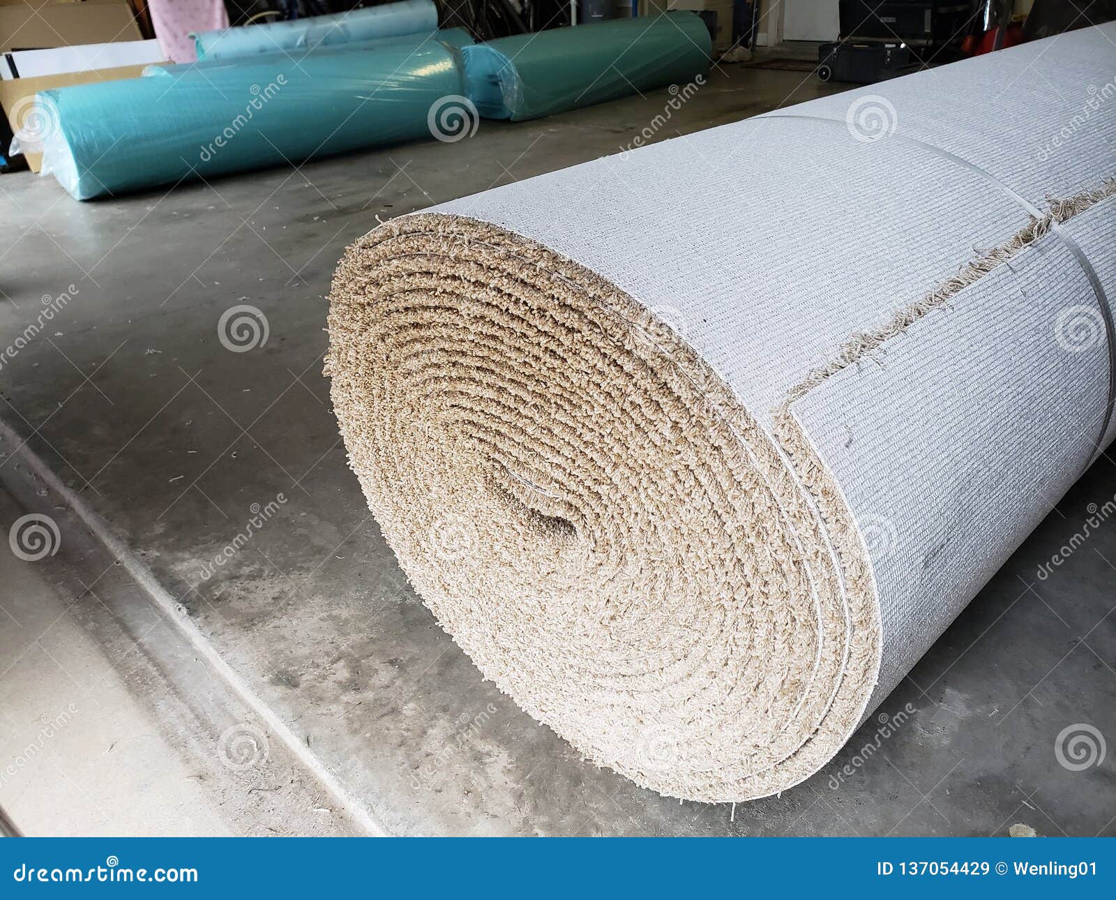 Rolls of New Carpet in the Garage of House for Replace Stock Image
