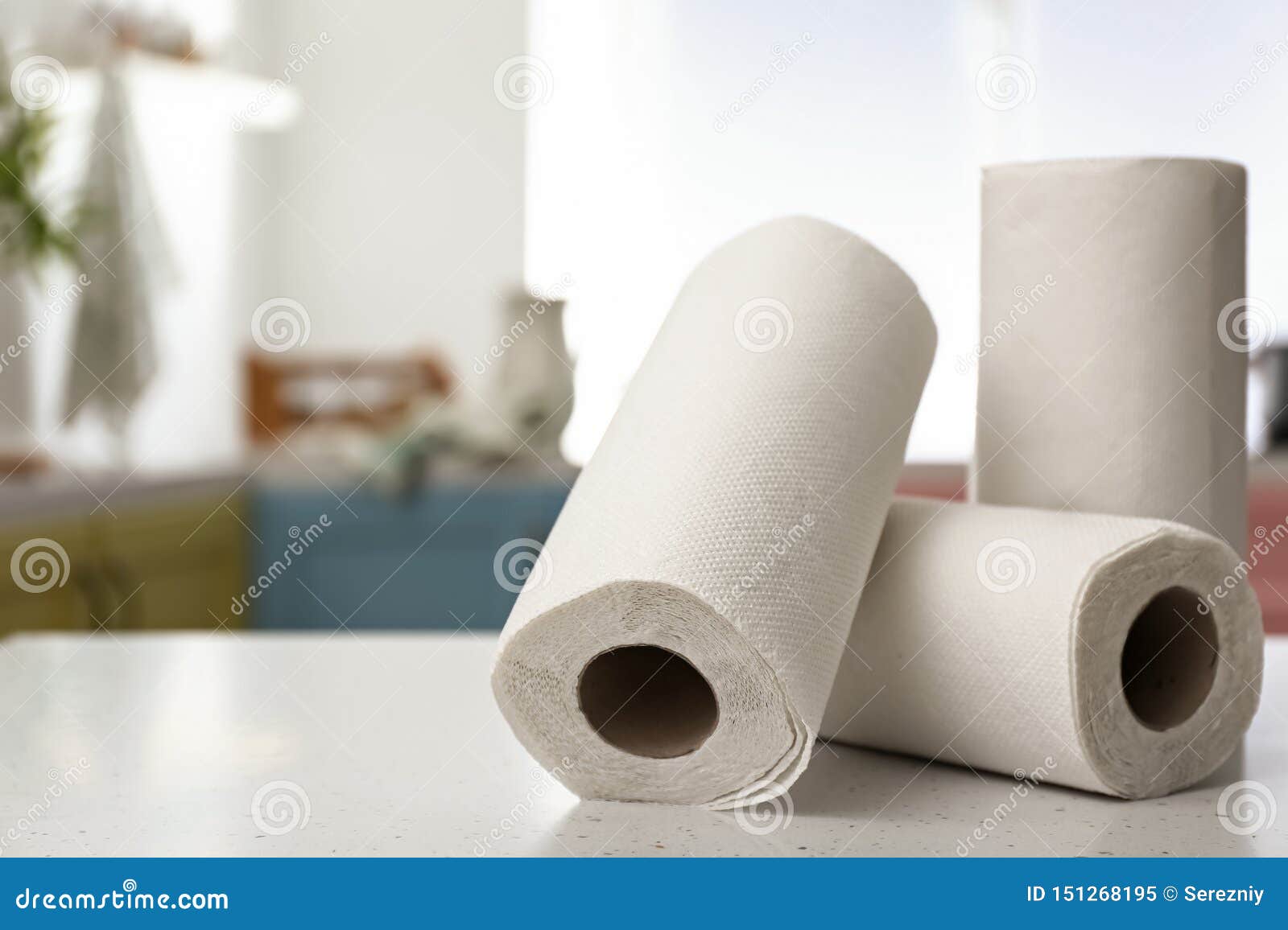 rolls of paper towels on kitchen table