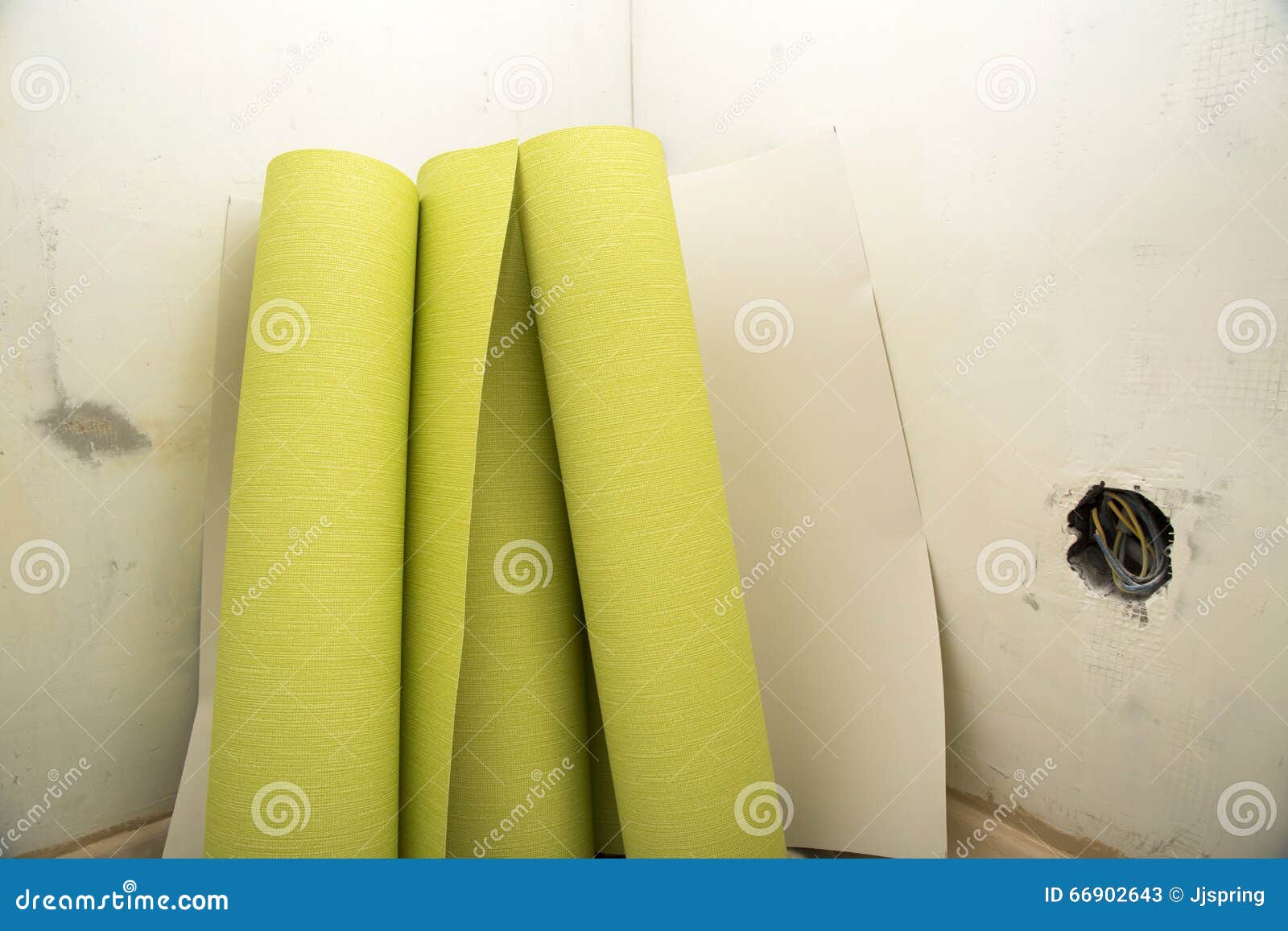 Rolls of Wallpaper by Plastered Wall Stock Image Image of filler