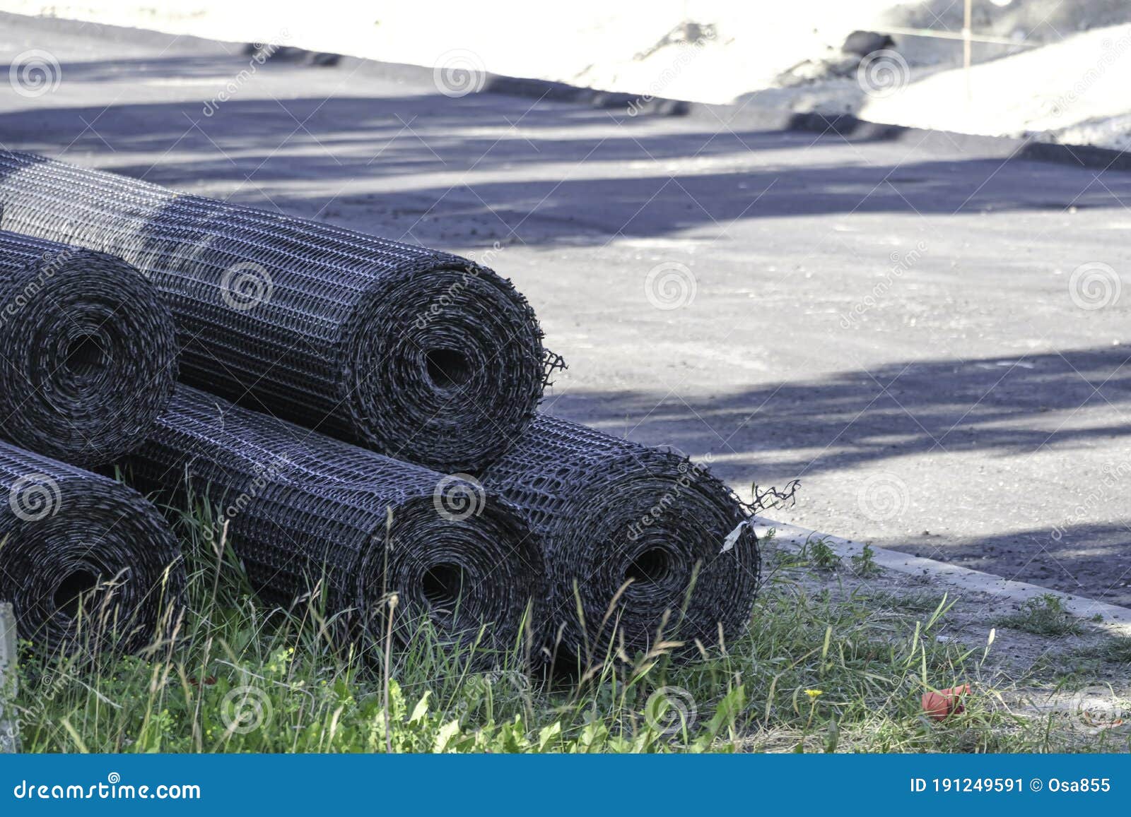 Rolls of Wire Mesh Fencing at Roadside at a Construction Site Stock