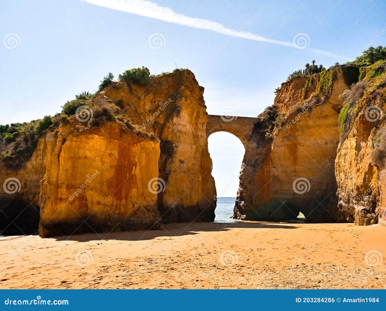 roman bridge in praia dos estudiantes in lagos in the portuguese algarve