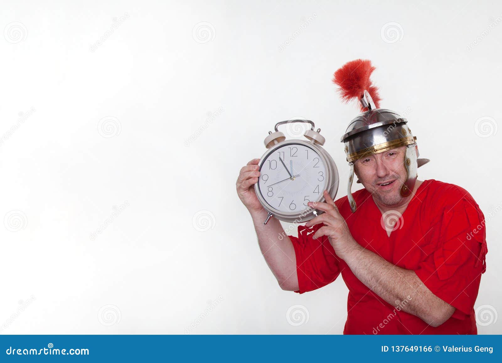 A Roman Soldier with a Big Alarm Clock Stock Photo Image of humor