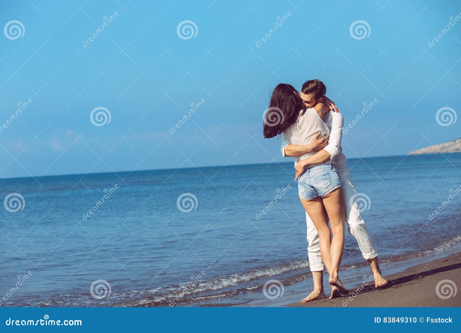 Romance on Vacation Couple in Love on the Beach Flirting Stock Photo