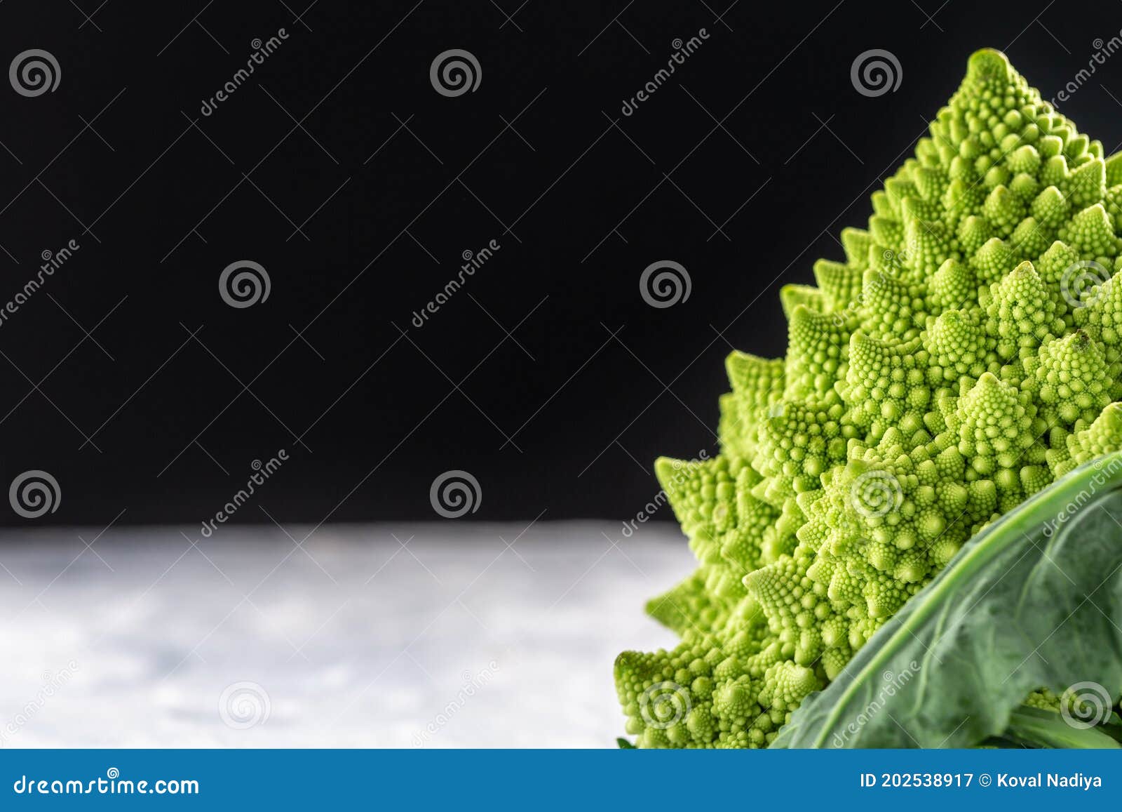 romanesco broccoli close up. the fractal vegetable is known for it`s connection to the fibonacci sequence and the golden ratio.