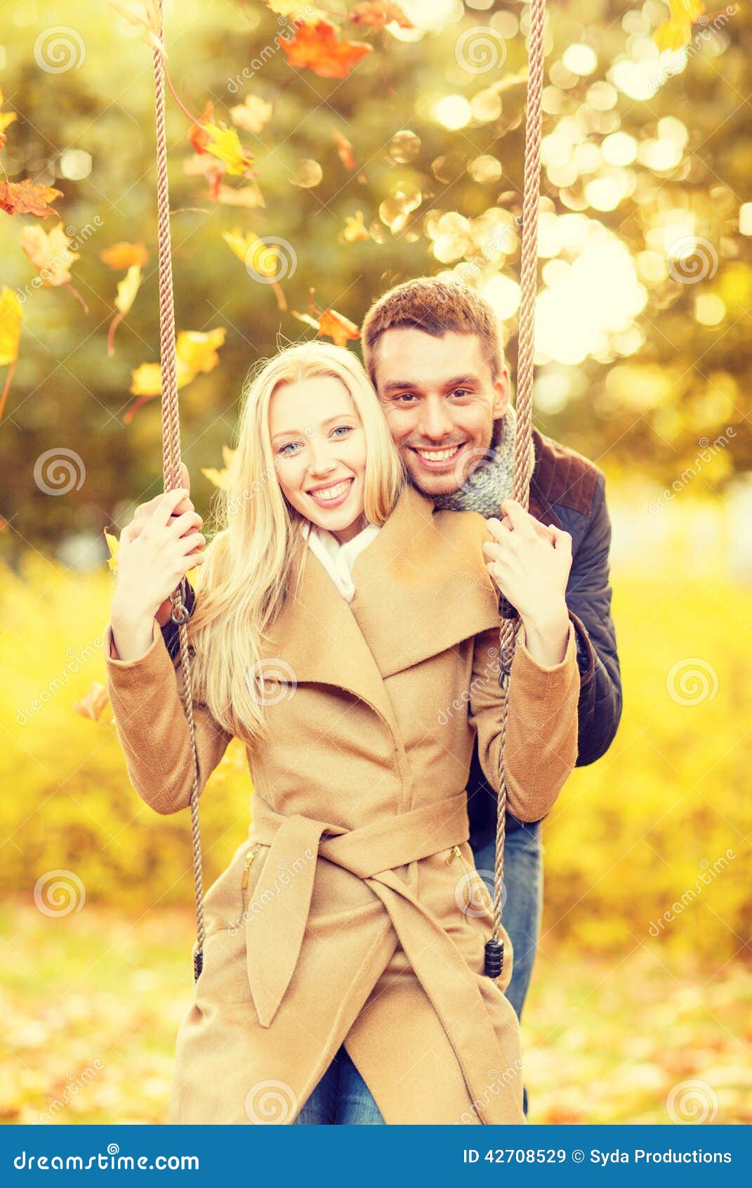 Holidays, love, travel, relationship and dating concept - romantic couple in the autumn park.