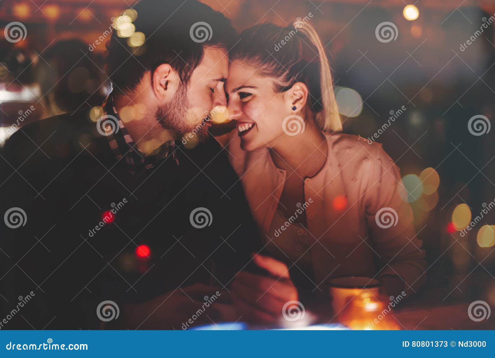 romantic couple dating in pub