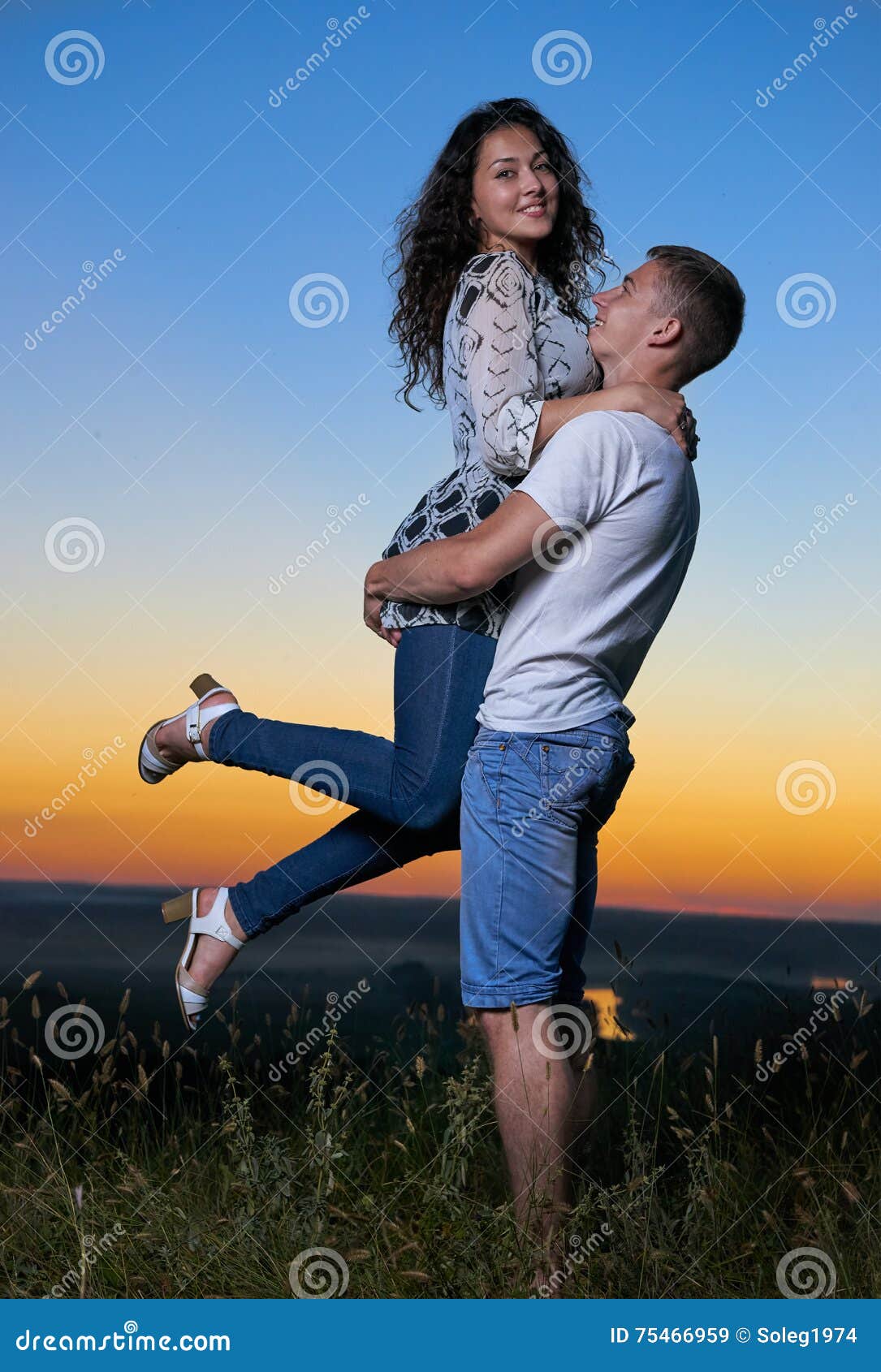 Romantic Couple Embrace at Sunset, Boyfriend Raise Up Girlfriend ...