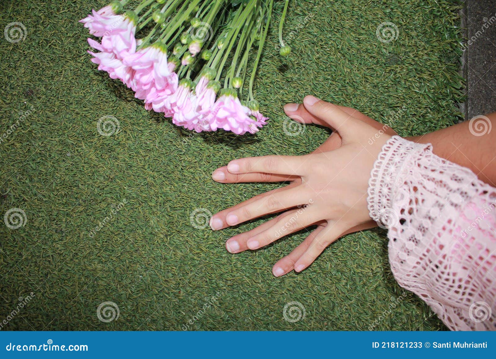 Romantic Couple Holding Hand with Flowers on the Background Stock Image