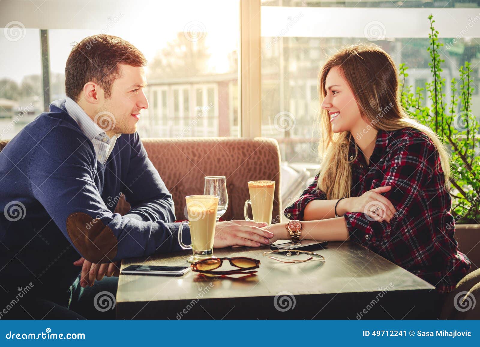 Romantic Couple Holding Hands at Coffee Shop Stock Image - Image