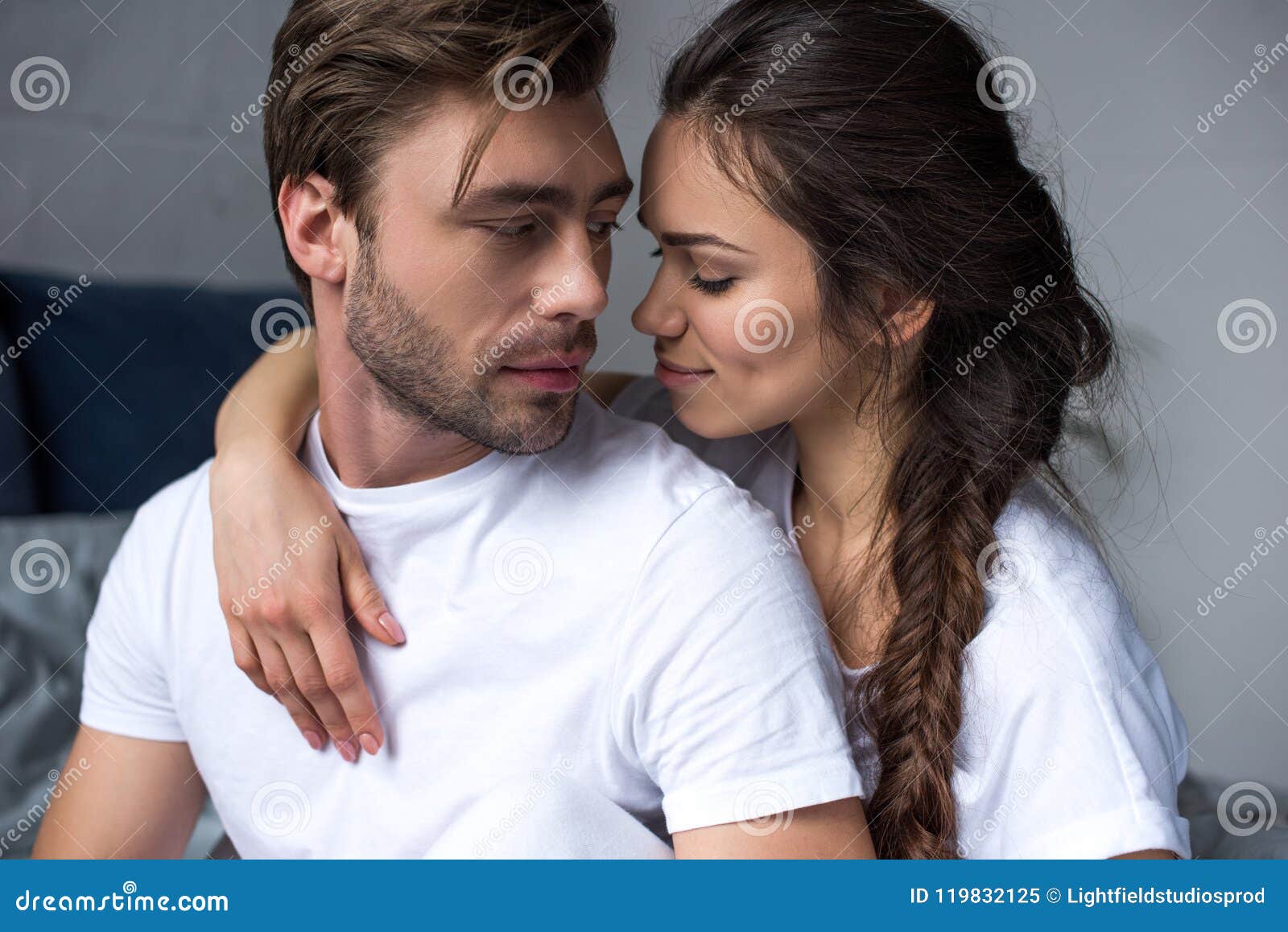 Romantic Couple Hugging on Bed Stock Image - Image of interior, home