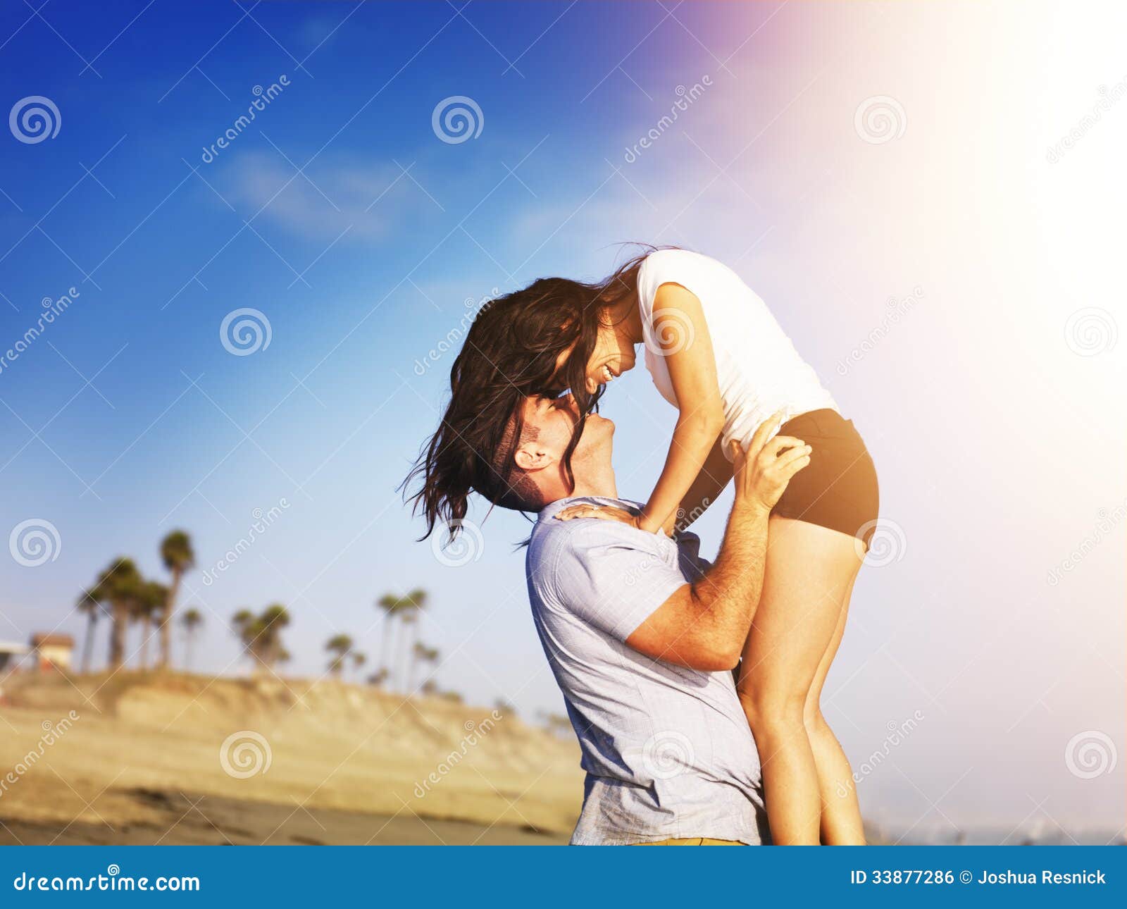 romantic couple in intimate moment on the beach.