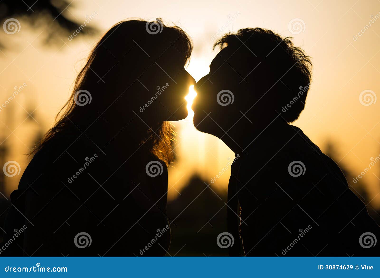 Romantic Couple Kissing at Sunset Stock Image - Image of kiss ...