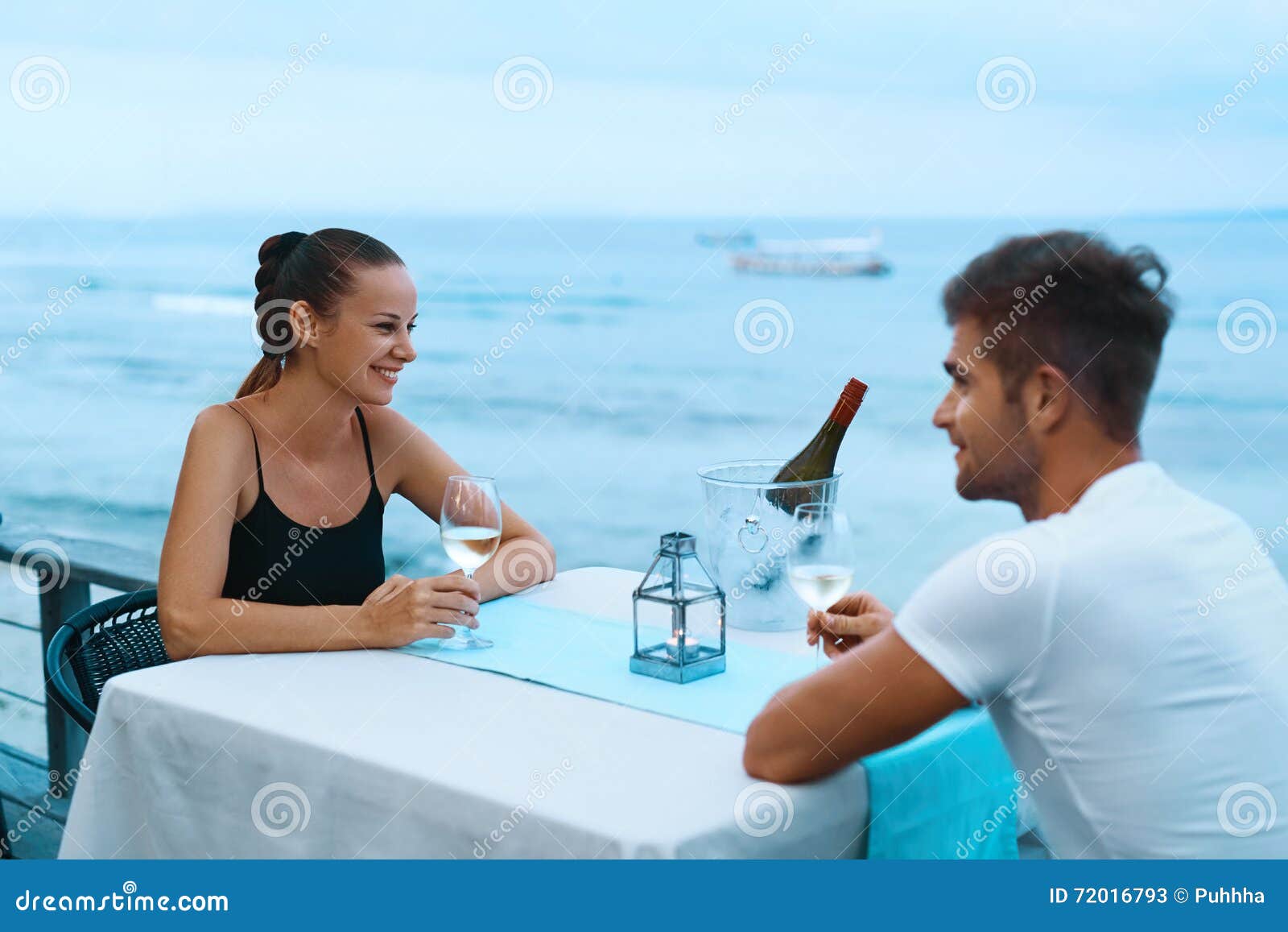 Romantic Couple in Love Having Dinner at Sea Beach Restaurant Stock