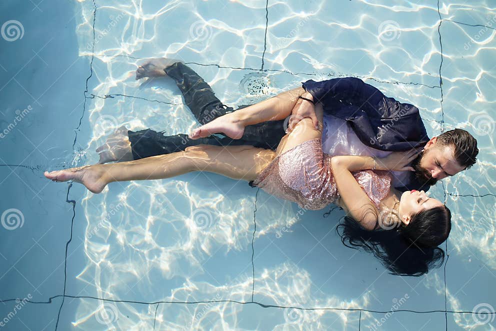 Romantic Couple In Love In Swimming Pool Party In Swimming Pool