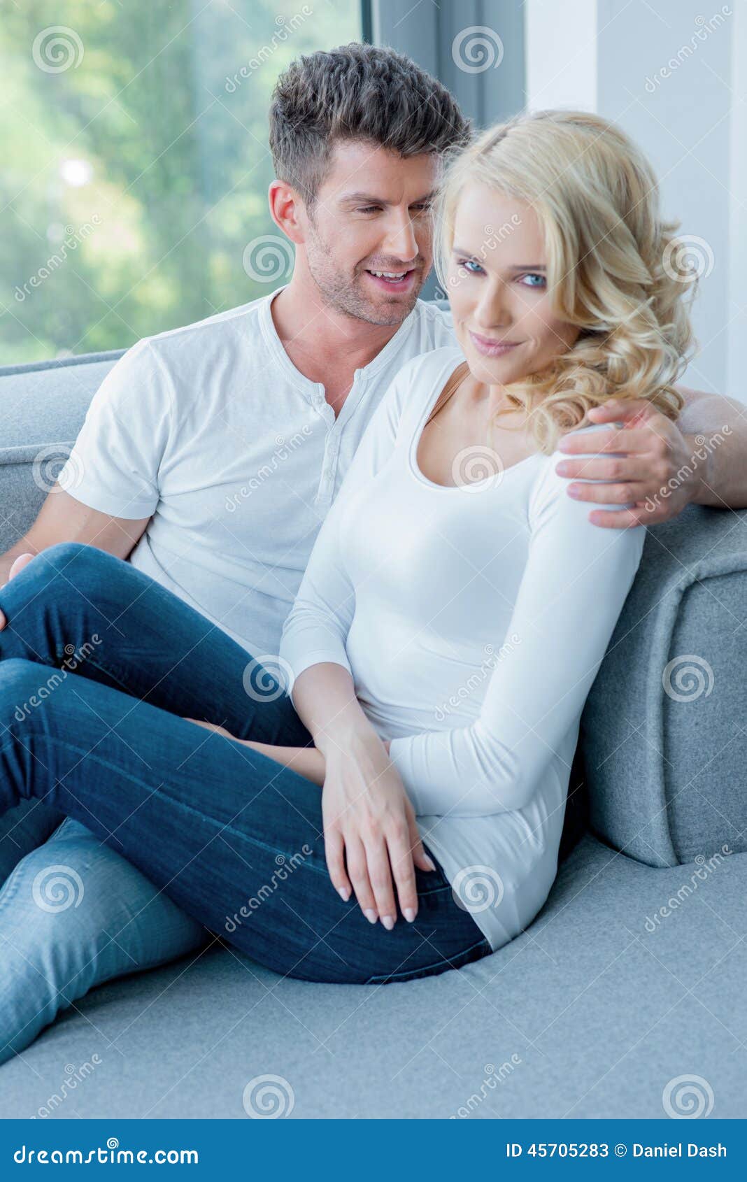 Romantic Couple Relaxing Close Together on a Sofa Stock Image Image