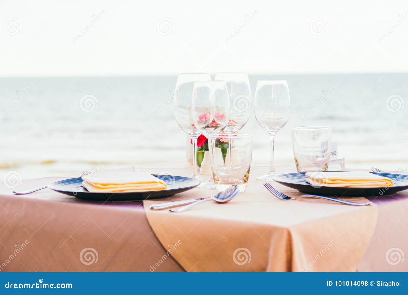 romantic dining table setting with wine glass and other