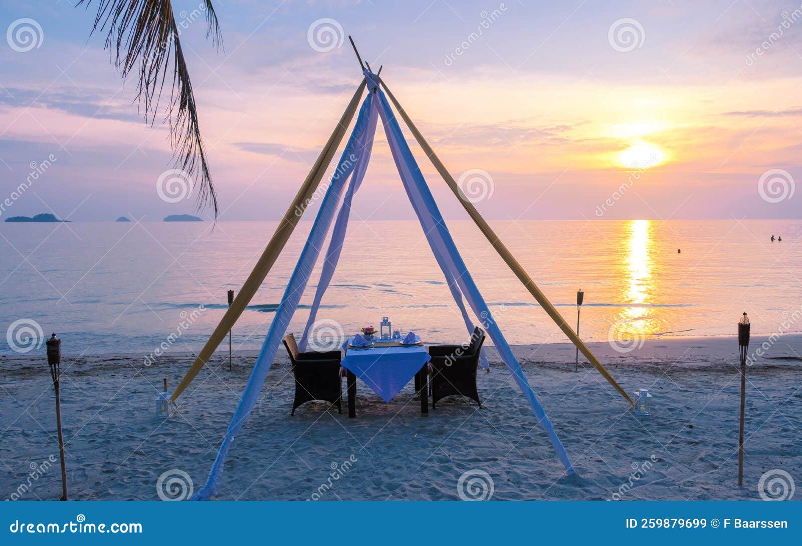 Romantic Dinner On A Beach In Koh Chang Thailand During Sunset Stock romantic-dinner-on-a-beach-in-koh-chang-thailand-during-sunset-stock