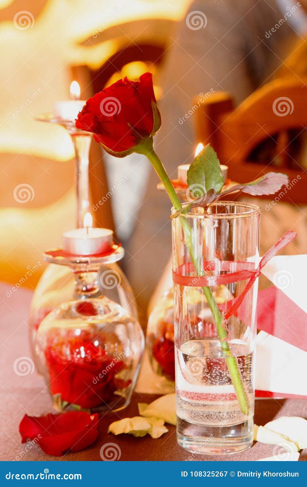 Romantic One Red Rose In A Glass Near Candles And Rose