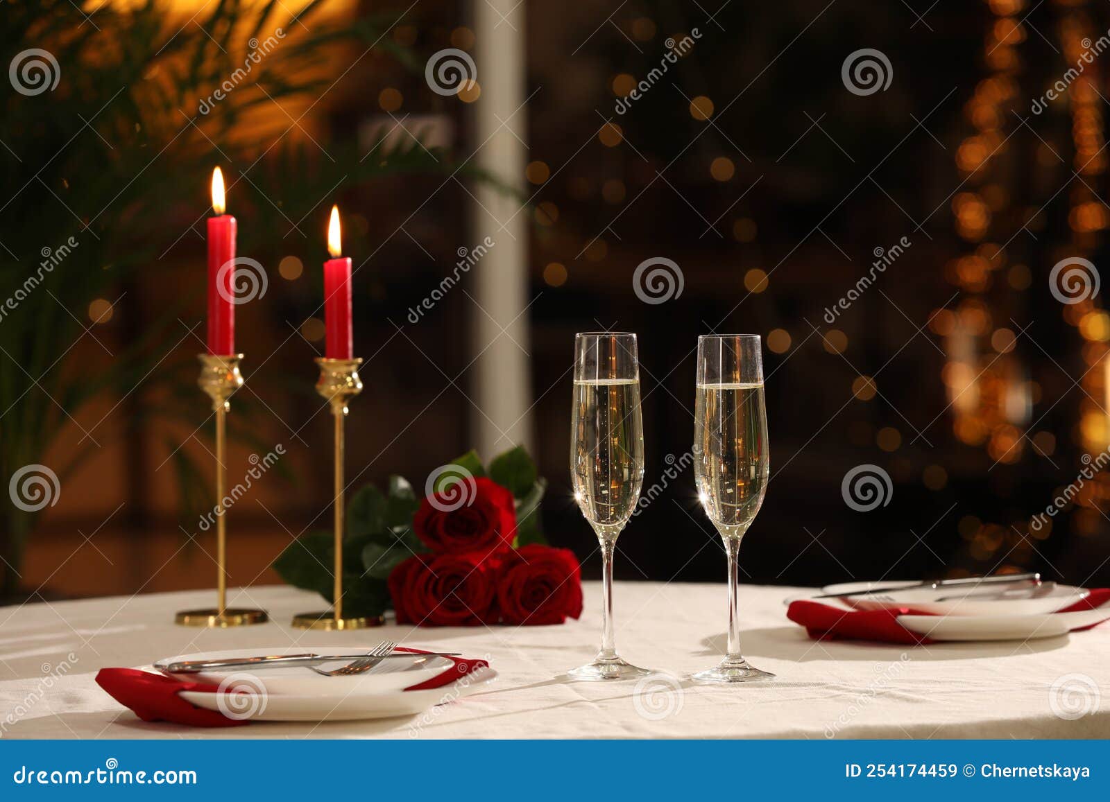 Romantic Dinner Table Setting with Glasses of Champagne in Restaurant
