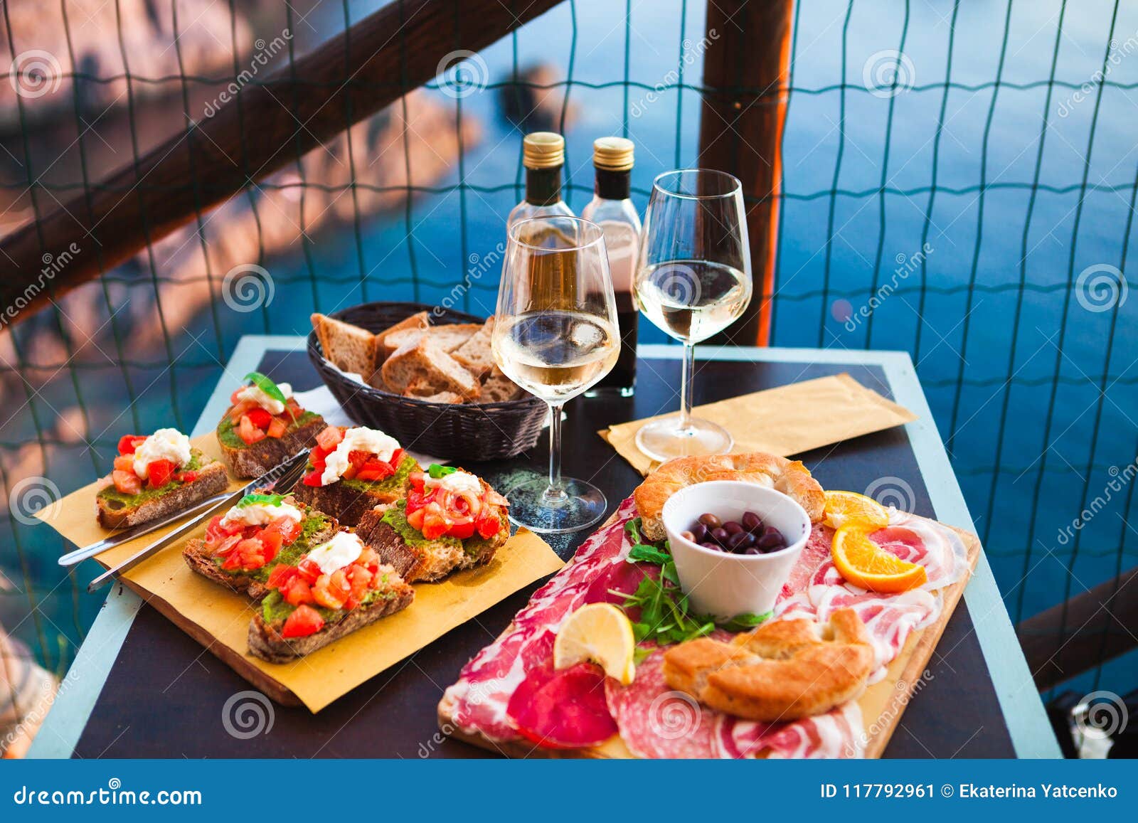 Romantic Dinner for Two at Sunset. White Wine and Tasty Italian Stock