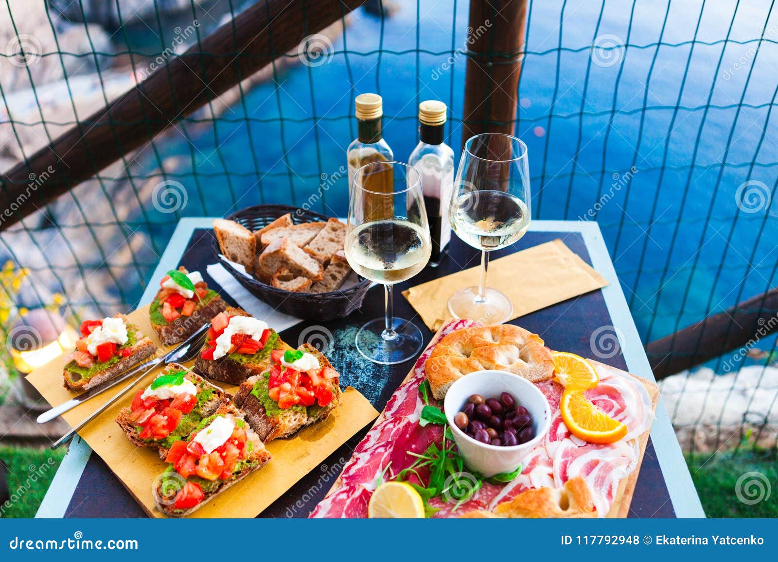 Romantic Dinner for Two at Sunset. White Wine and Tasty Italian Stock