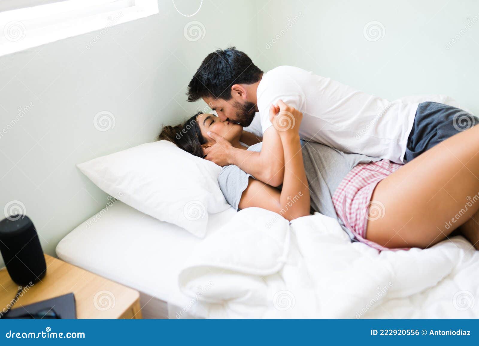 Good-looking girlfriend and boyfriend lying in bed.