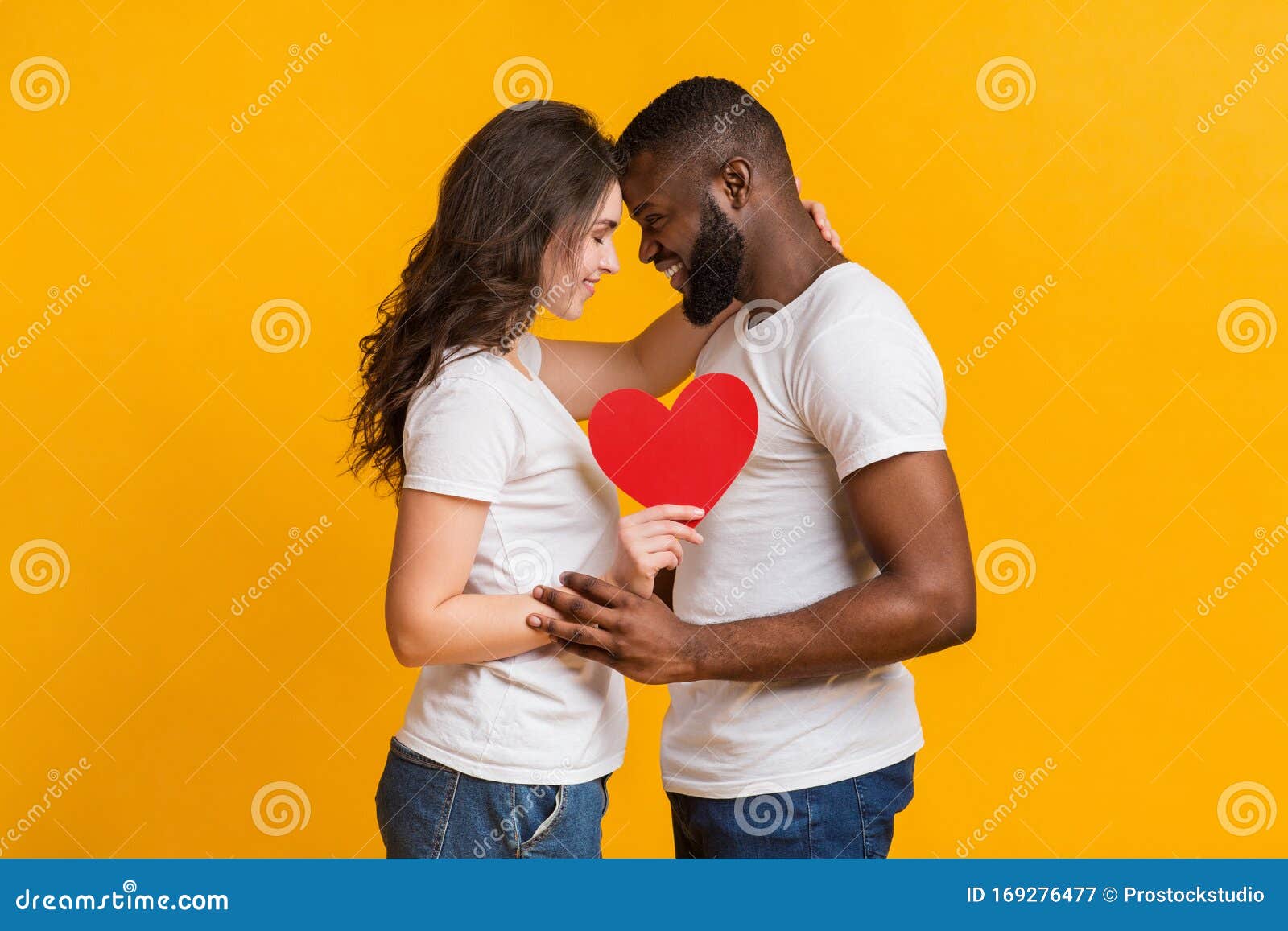 Romantic Interracial Couple Holding Red Paper Heart and Touching Foreheads  Stock Image - Image of interracial, lover: 169276477