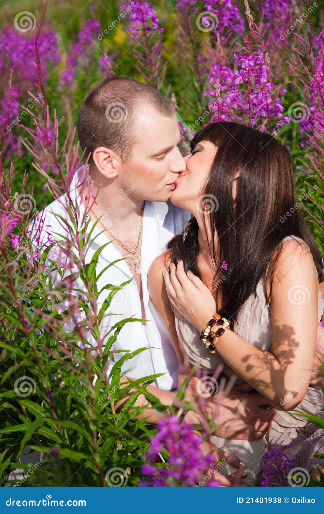 Romantic Kiss among Purple Flowers Stock Photo Image of close
