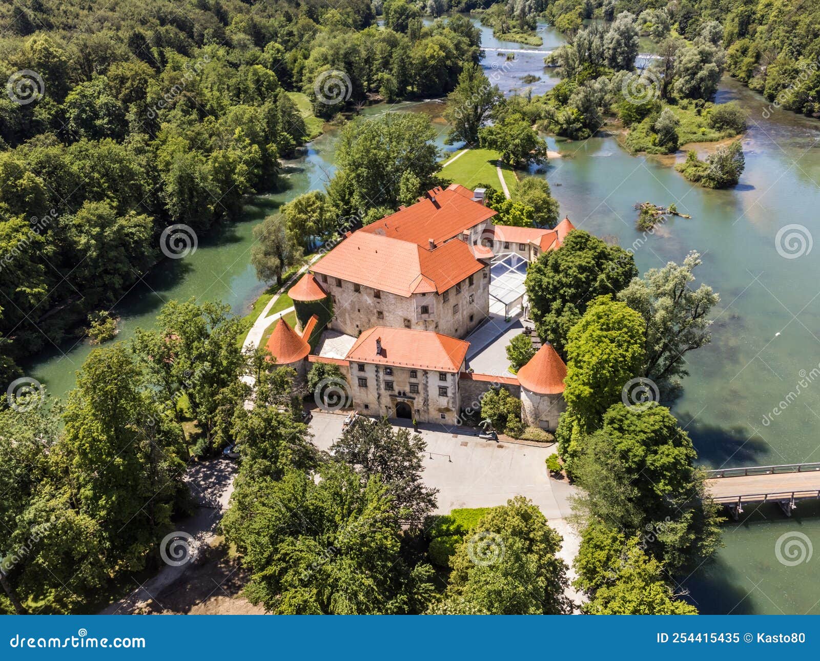 romantic otocec castle on krka river in slovenia. drone view.