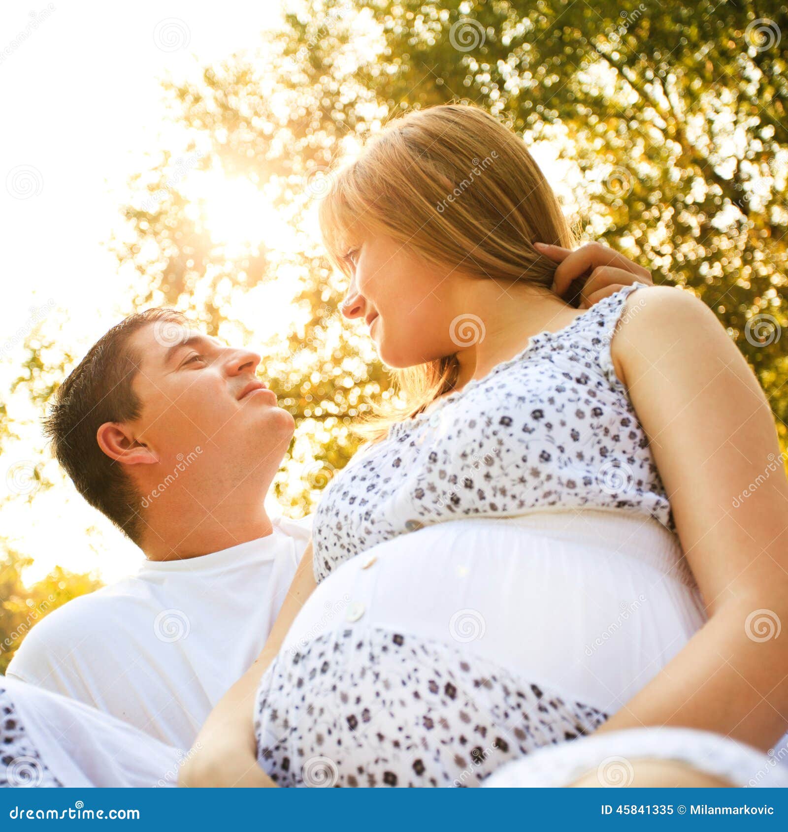 Romantic pregnant couple stock image. Image of sunlight 45841335