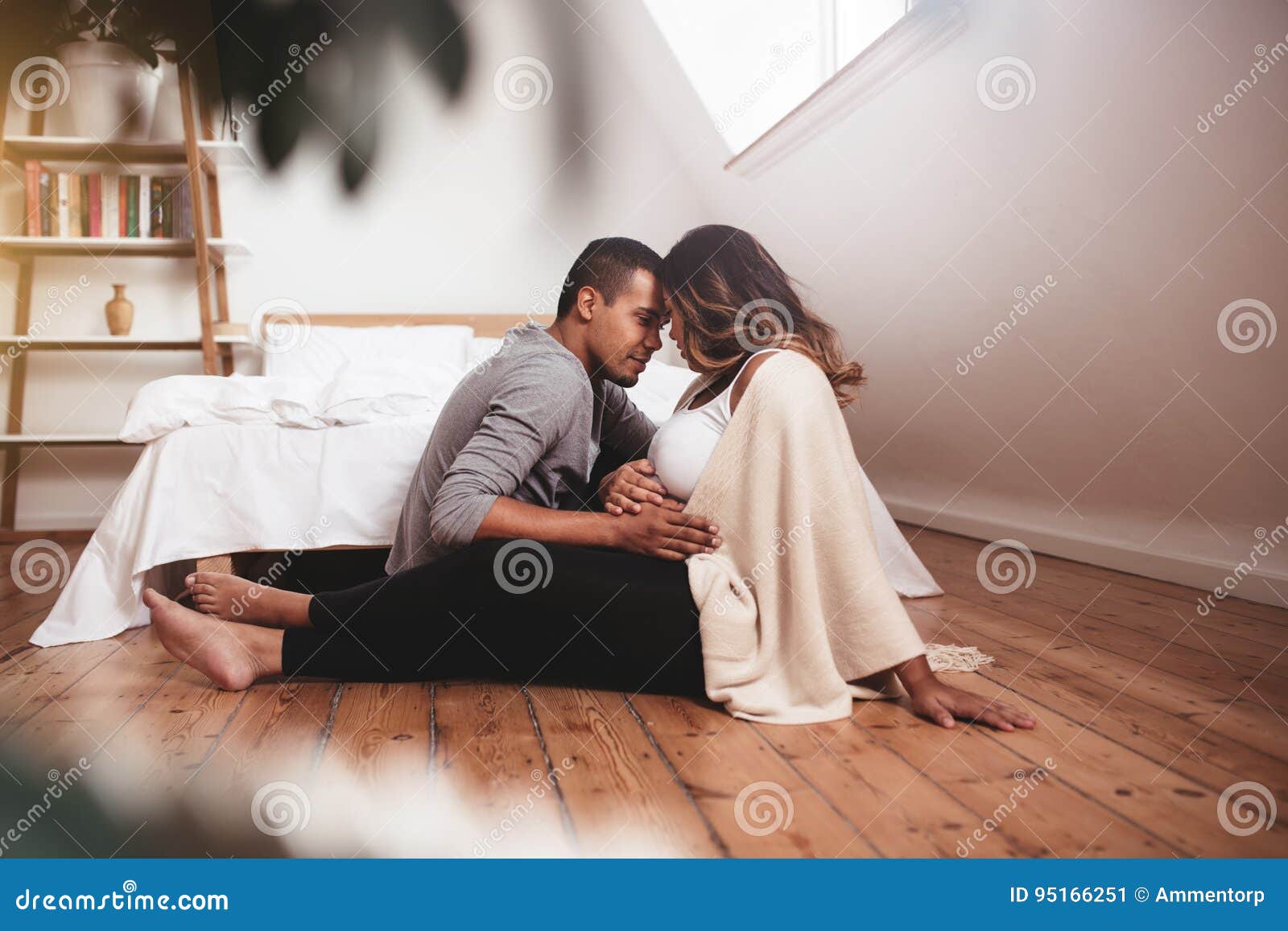Romantic Pregnant Couple Sitting on the Floor Stock Image - Image ...