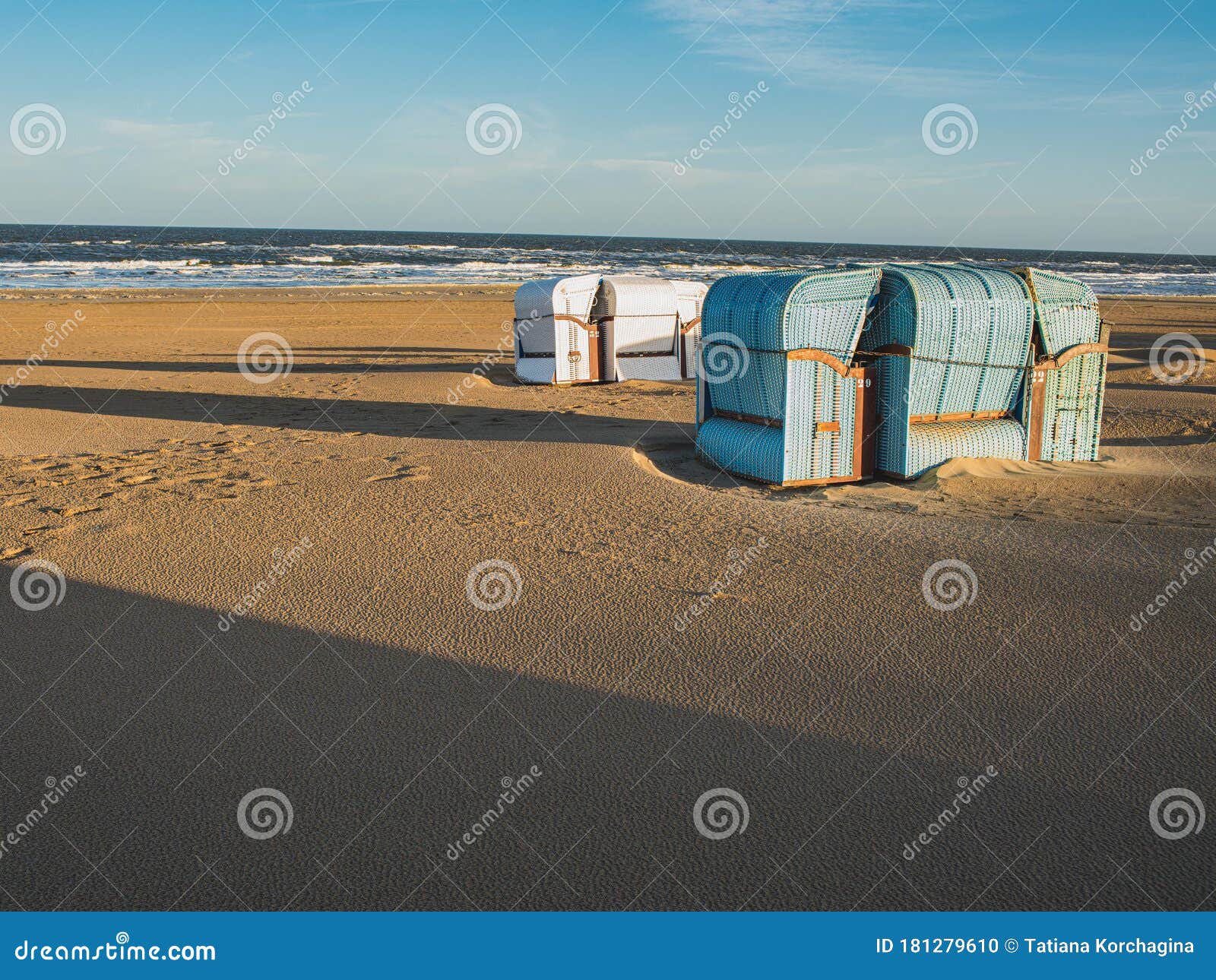 romantic summer beach with typical  dutch retro beachchairs in egmond aan zee, netherlands, europe