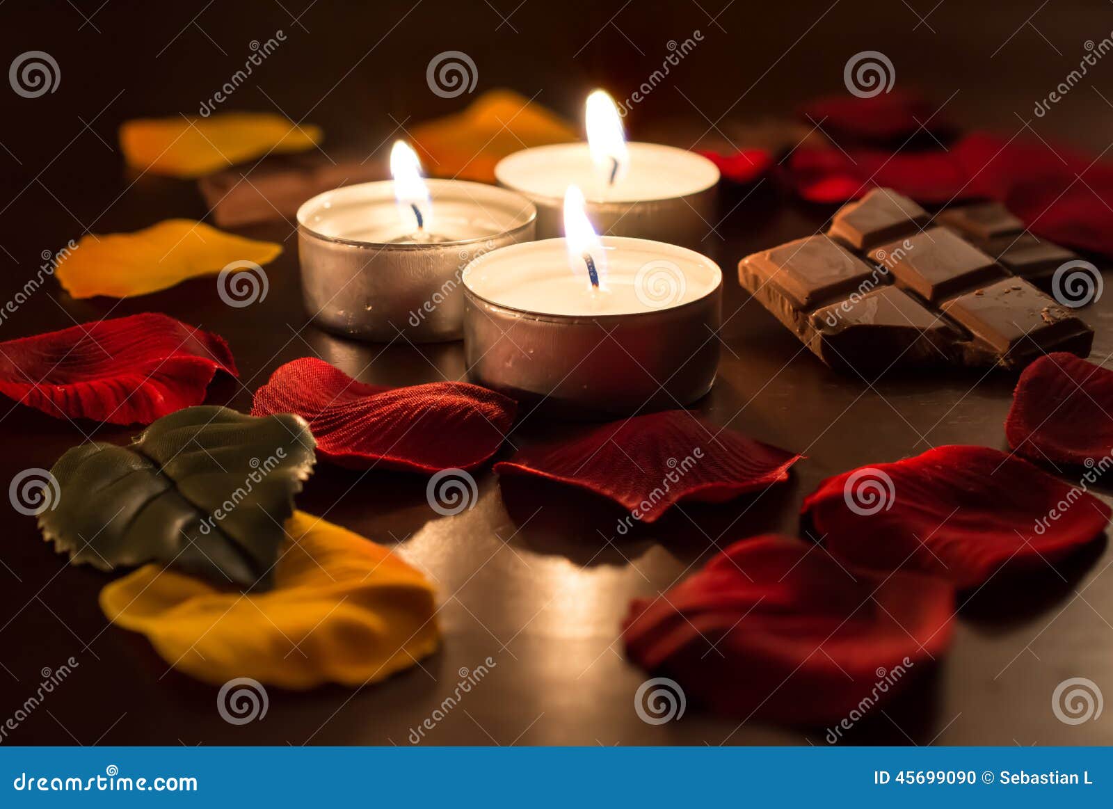 3 Romantic Tealights with Chocolate and Rose Petals Stock Photo Image of affection, table