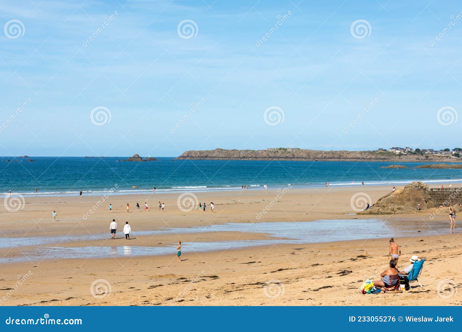 Romantic Walk Of People On The Picturesque Beach Of Saint Malo 