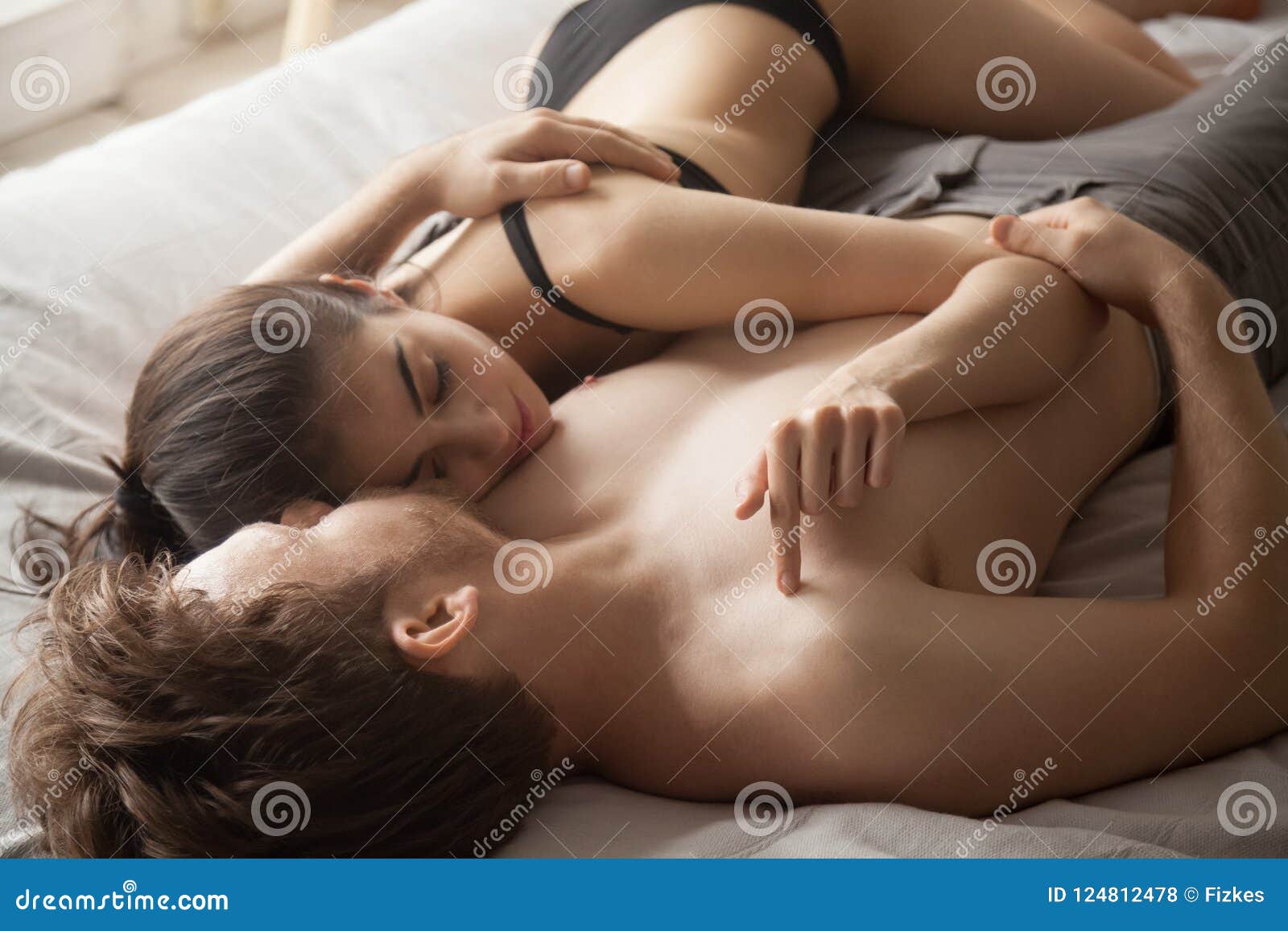 Romantic Couple Lying In Bed Embracing After Love Making Stock Photo 124812478 pic