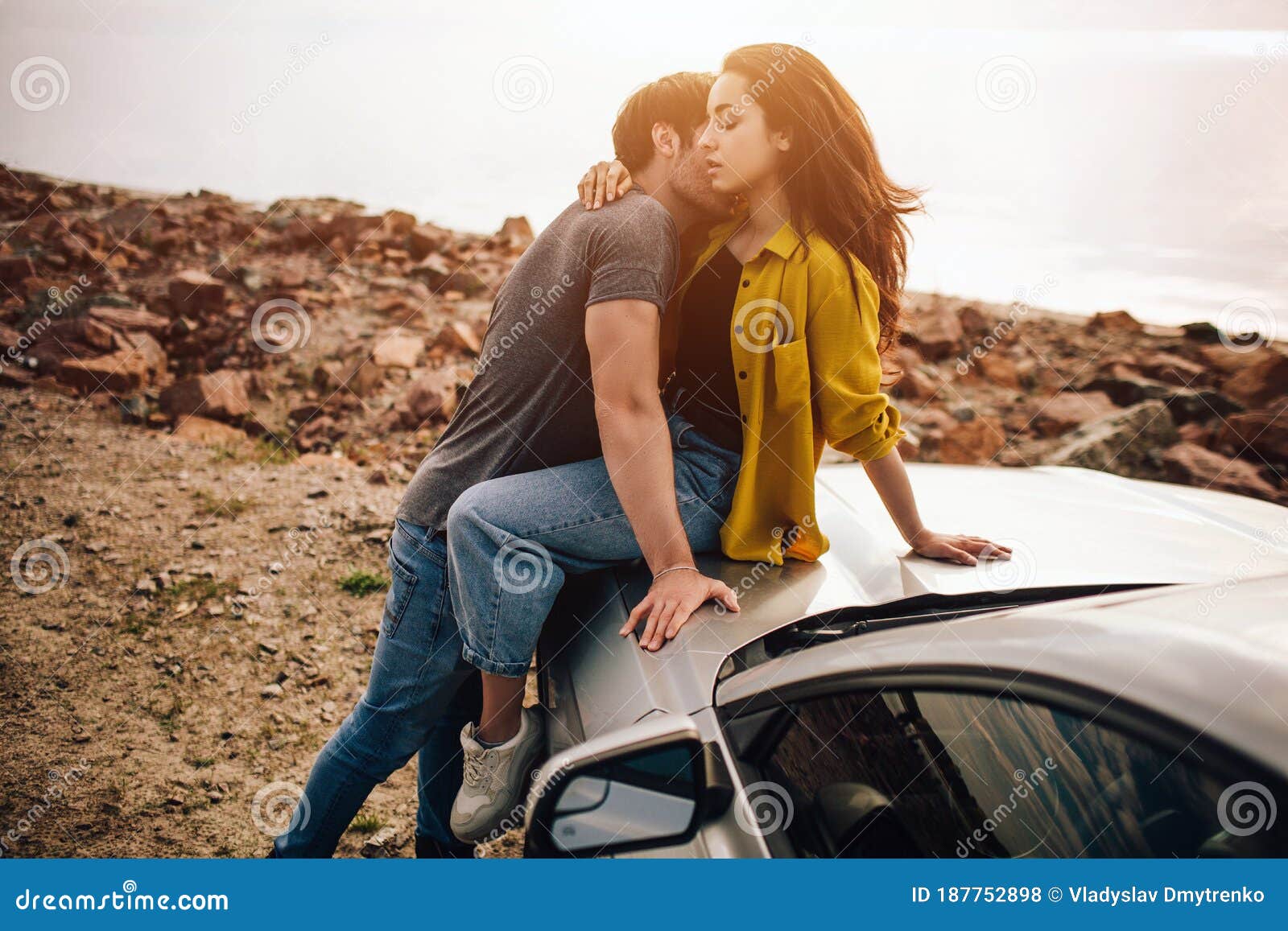 Young Couple Sitting On Bonnet Parked Stock Photo 215278807