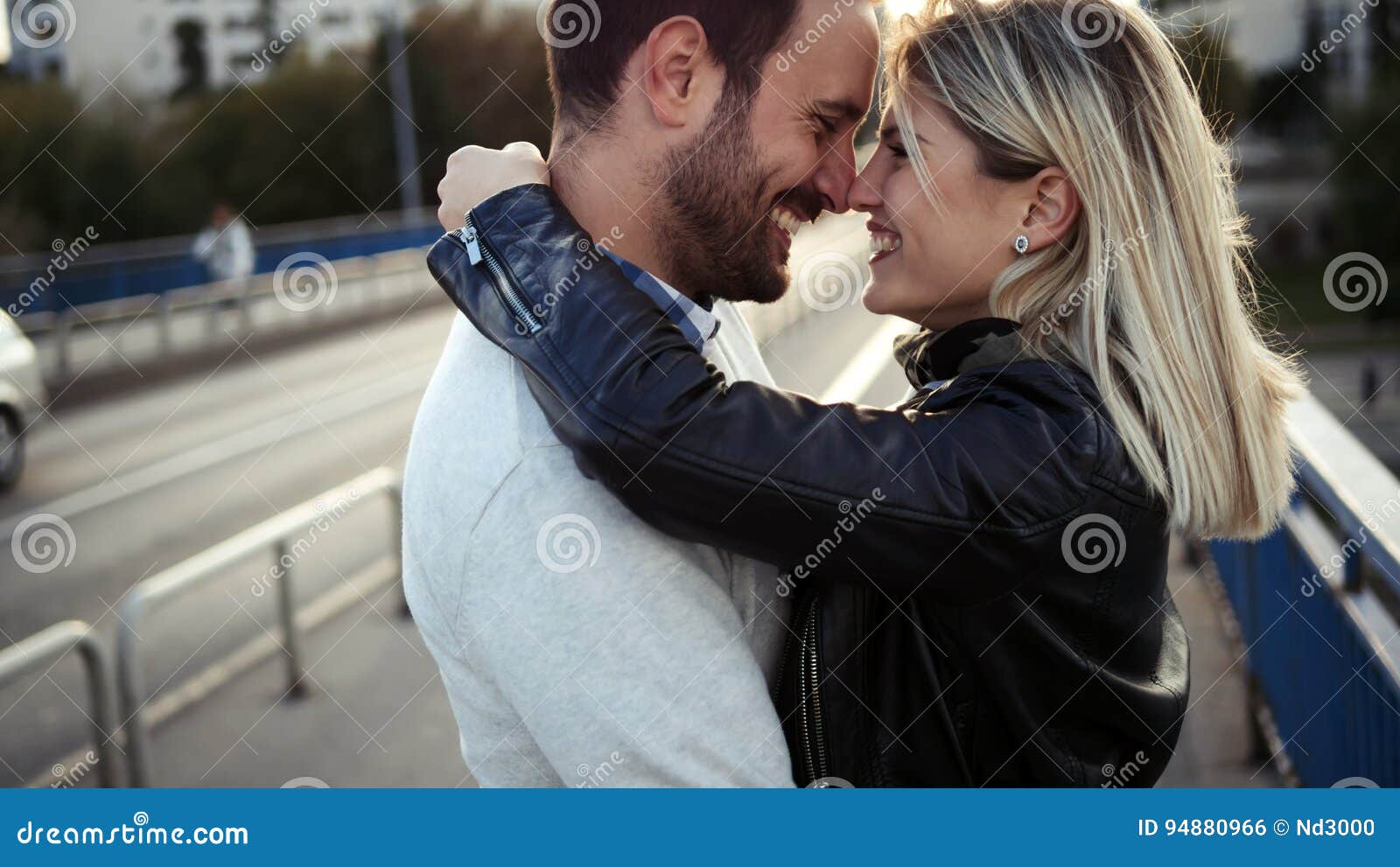 romantic young happy couple kissing and hugging
