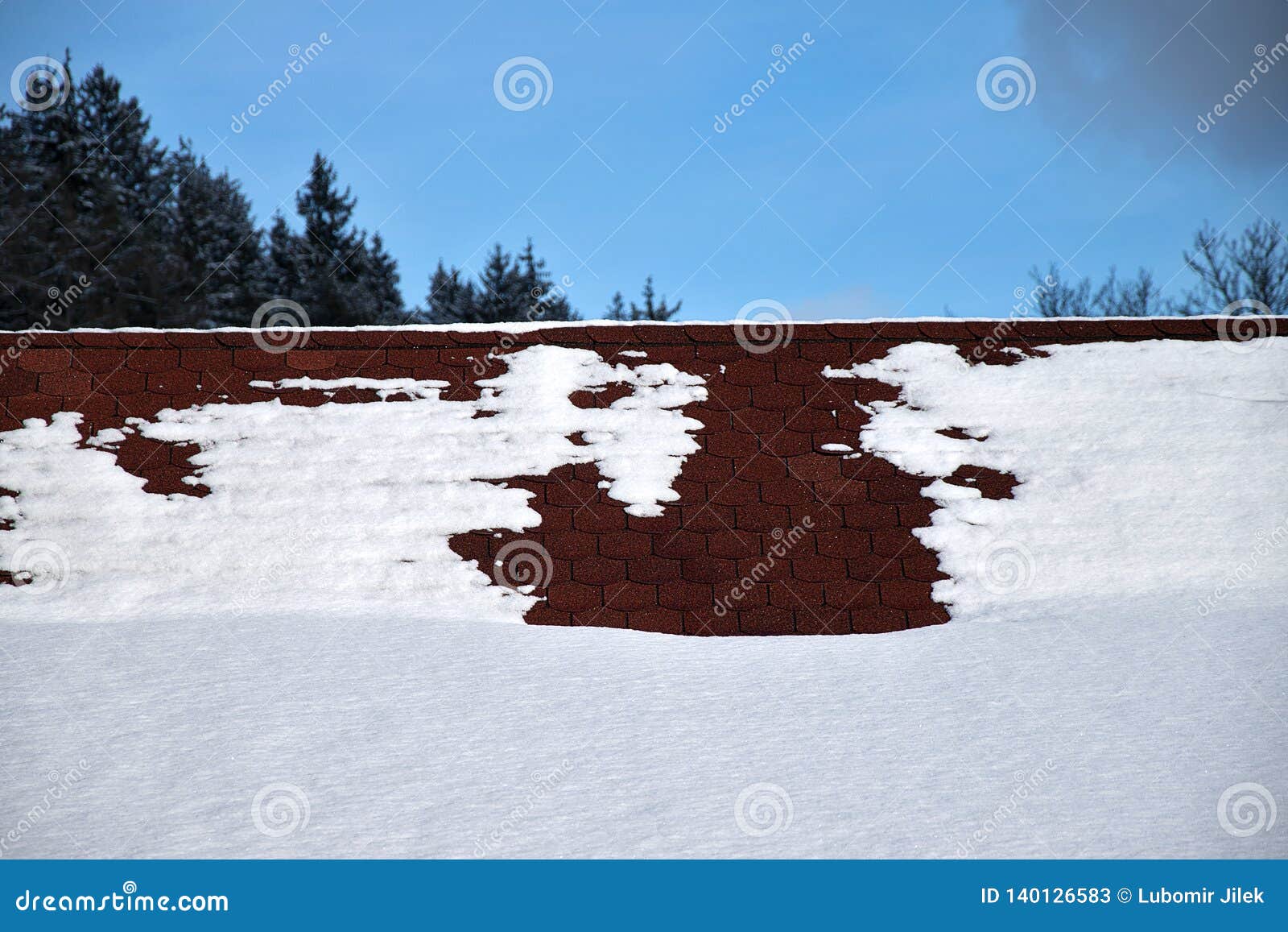 Roof in Winter. Roof with Asphalt Shingles Covered with Snow Stock