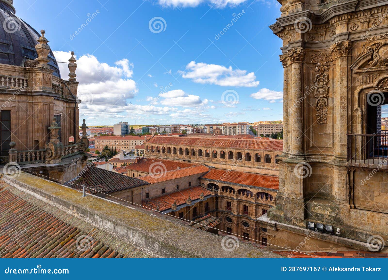 rooftop of la clerecia building in salamanca, spain with decorative baroque bell towers.