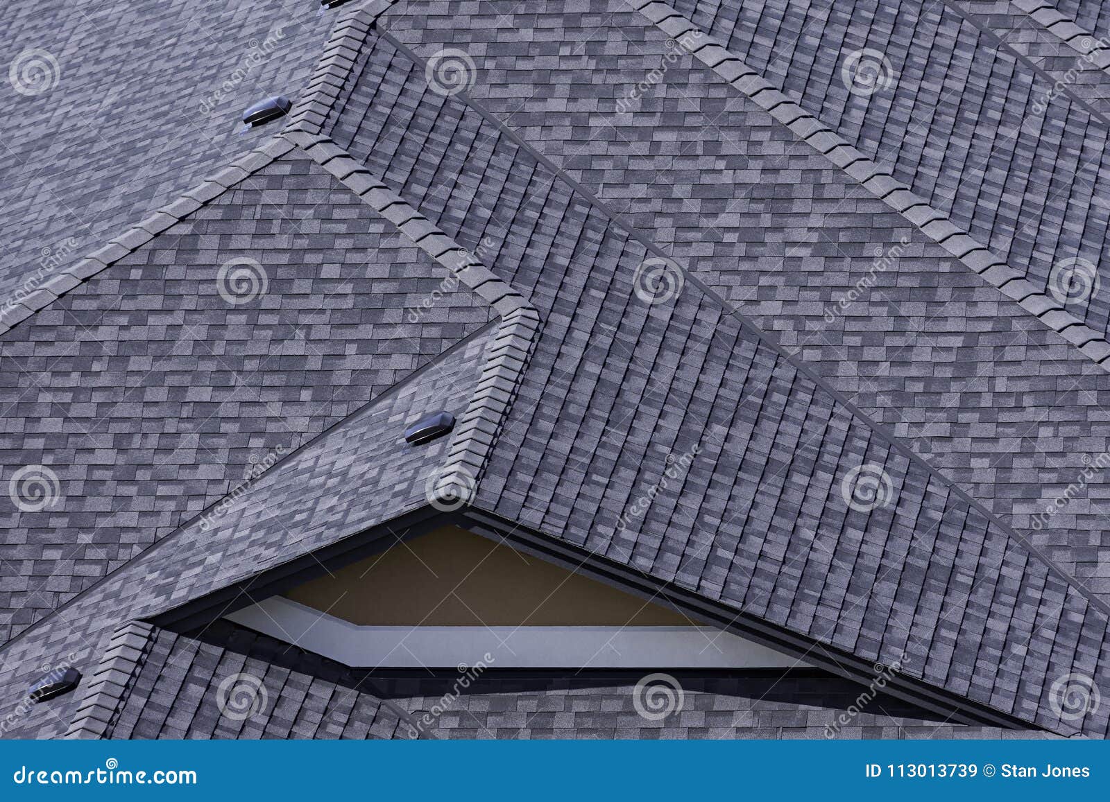 rooftop in a newly constructed subdivision in kelowna british columbia canada showing asphalt shingles