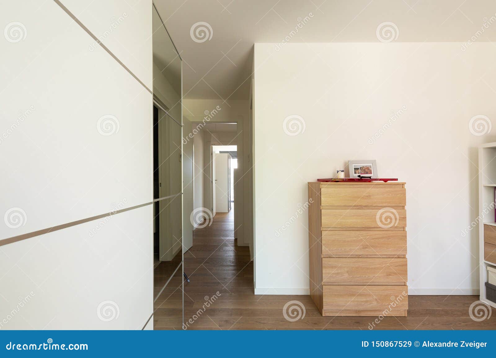 Room Detail With Wardrobe Chest Of Drawers And Hallway Stock
