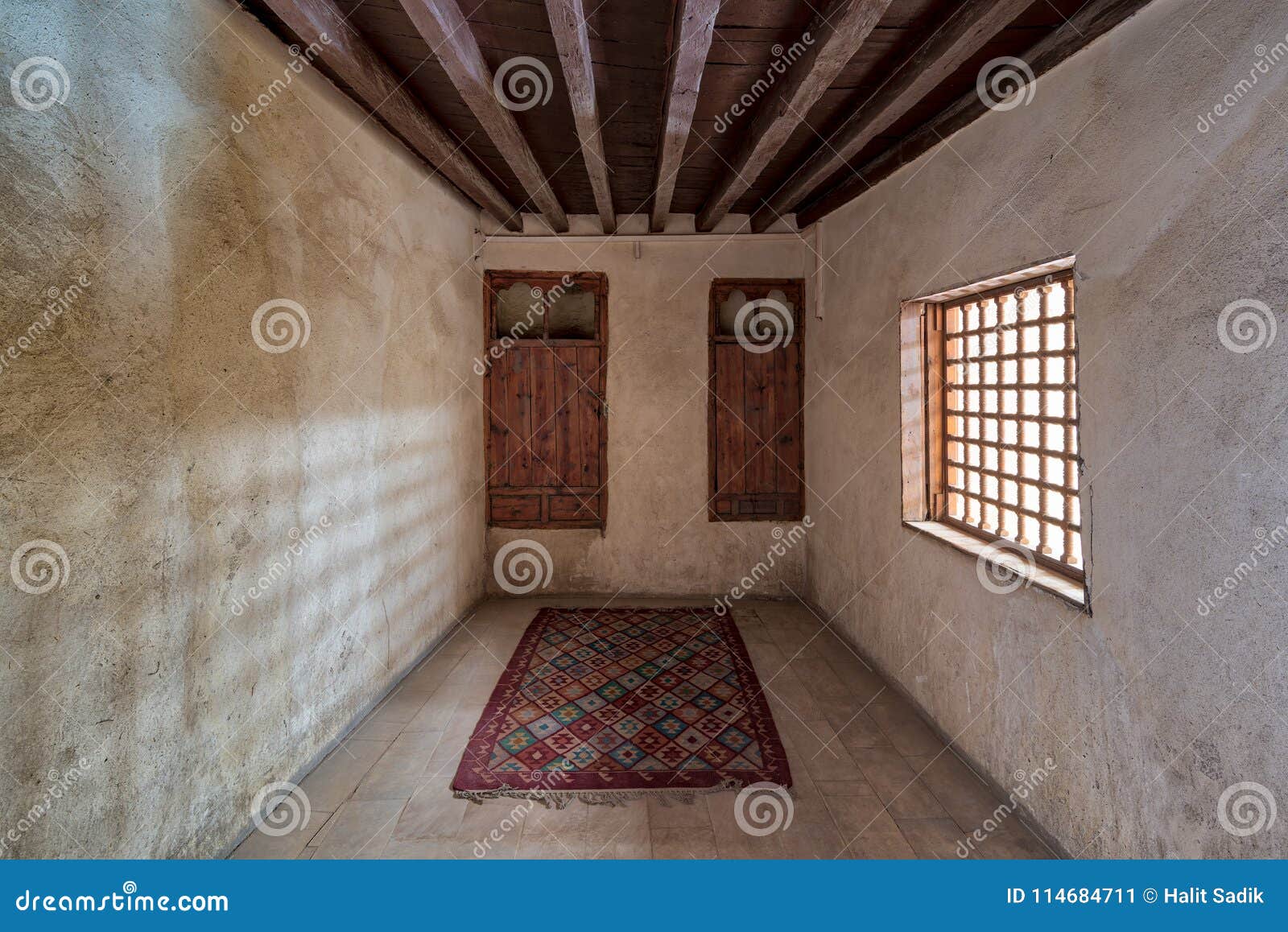 room at el sehemy house, a historic old house with embedded wooden cupboard, wooden window and colorful carpet, cairo, egypt