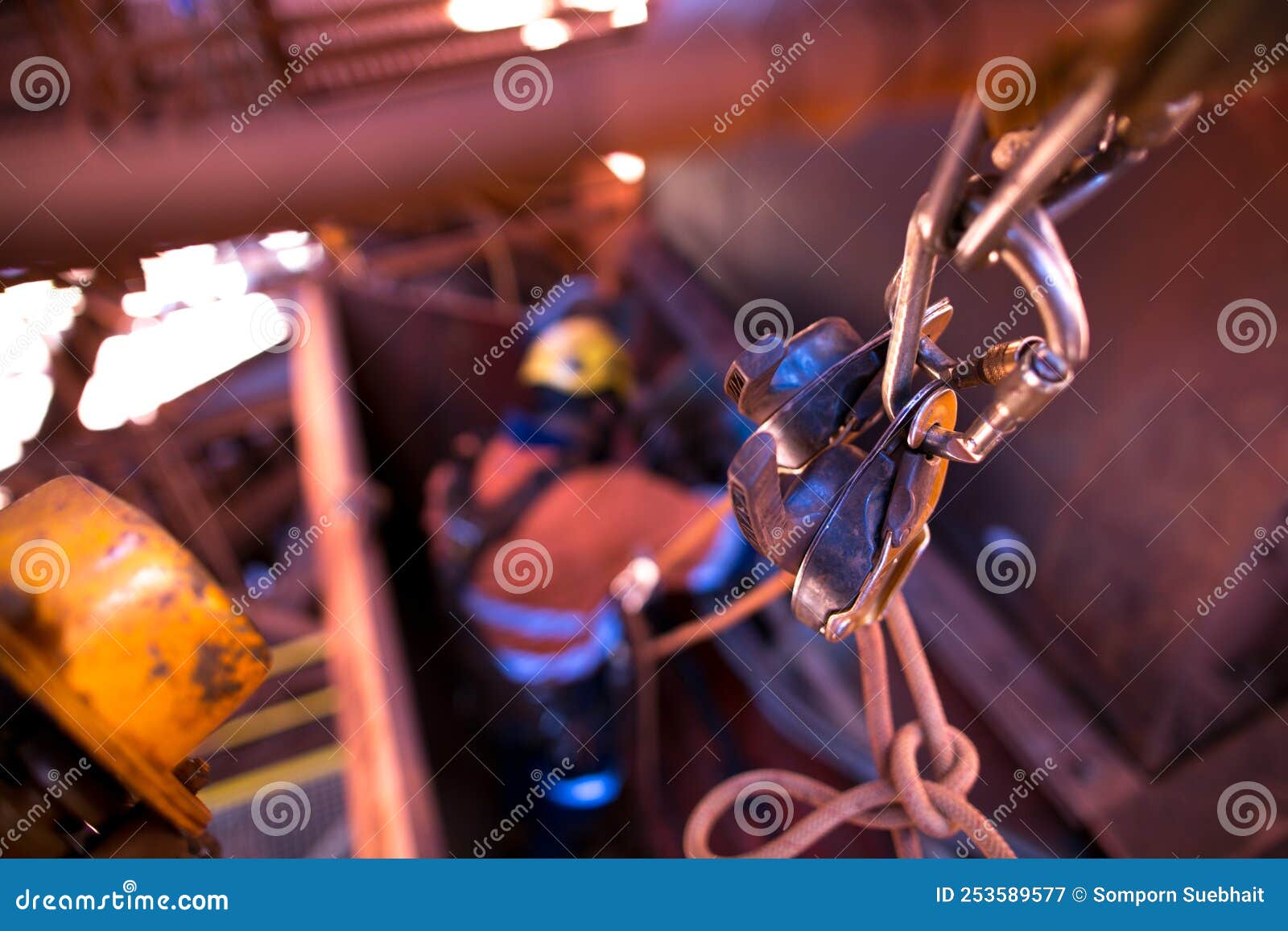 rope access anchor point rigging with two locking karabiner, two descenders clipping into low stretching rope