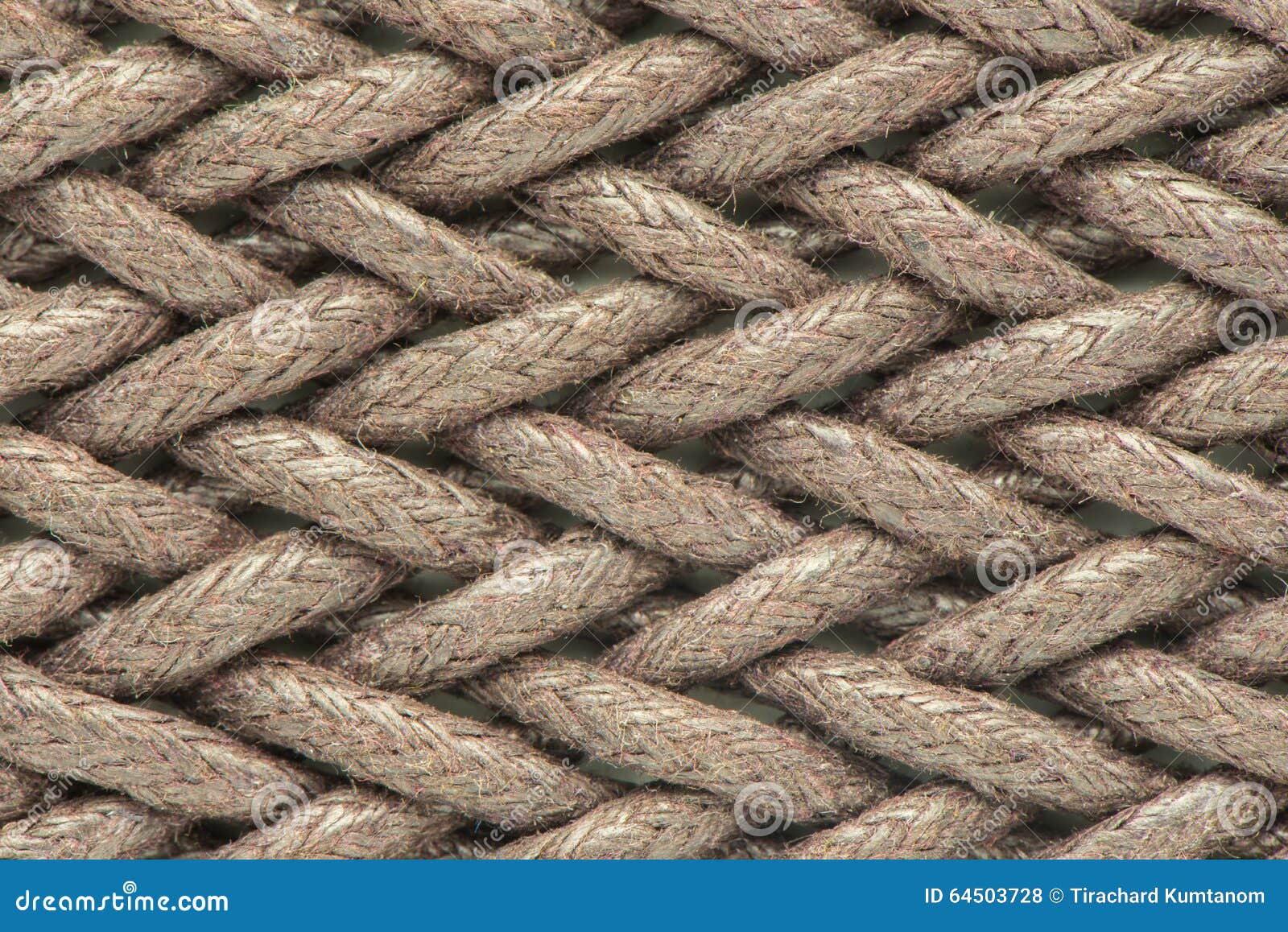 Bundle of round brown thin hemp rope with fiber texture isolated on a white  background.Twine