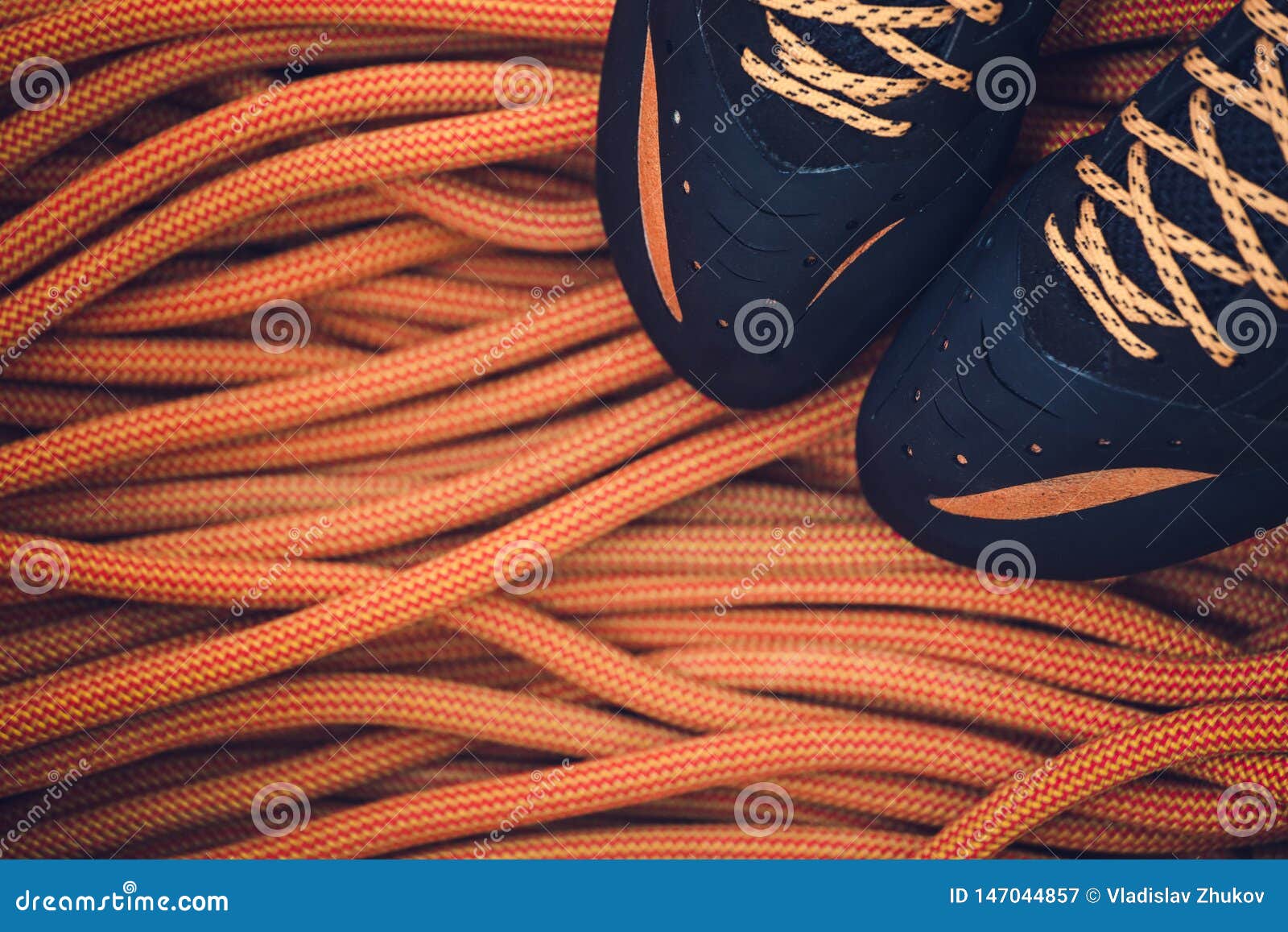 Rope and climbing shoes stock image 