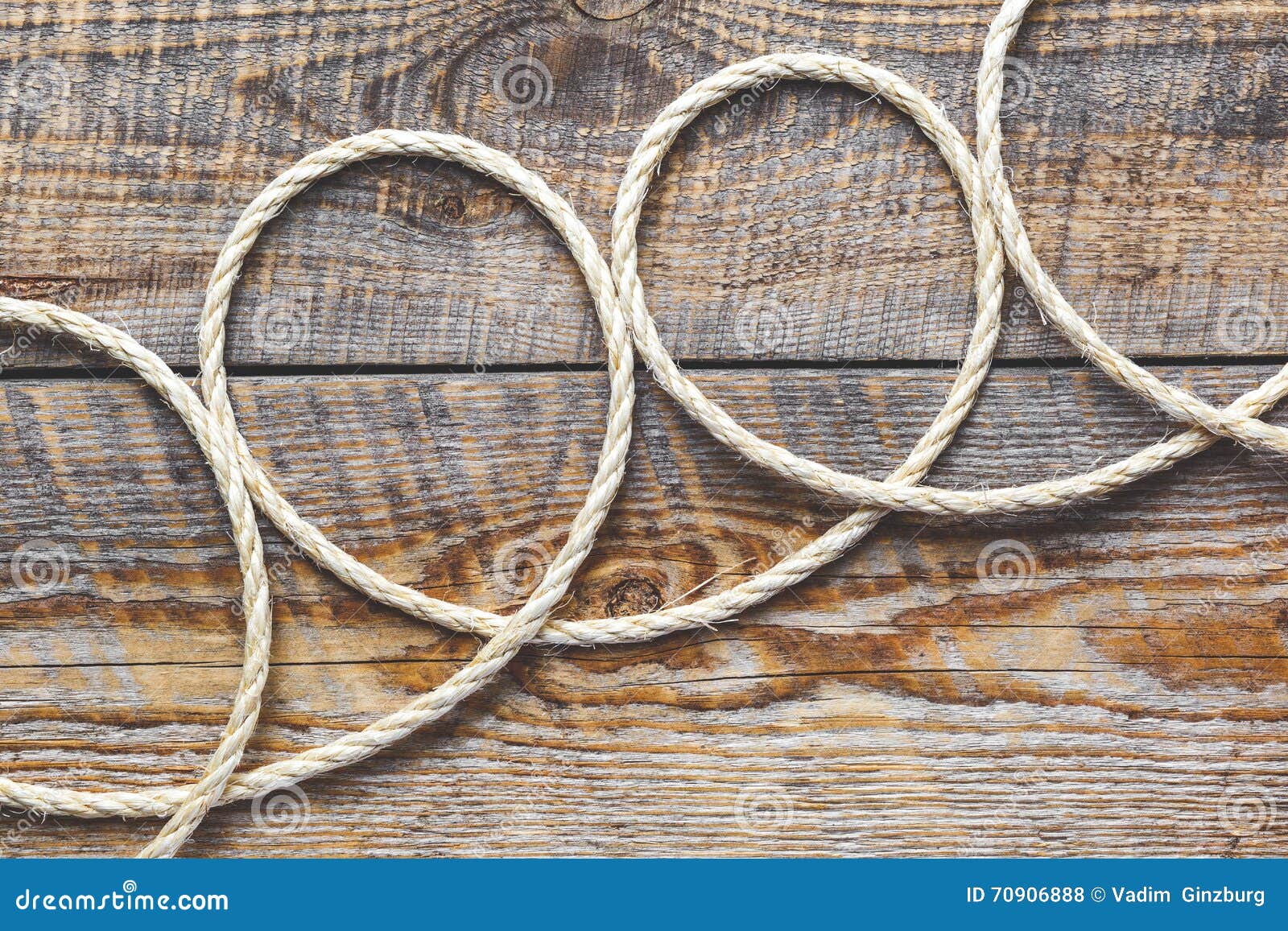 Rope gyrate on a wooden table close up