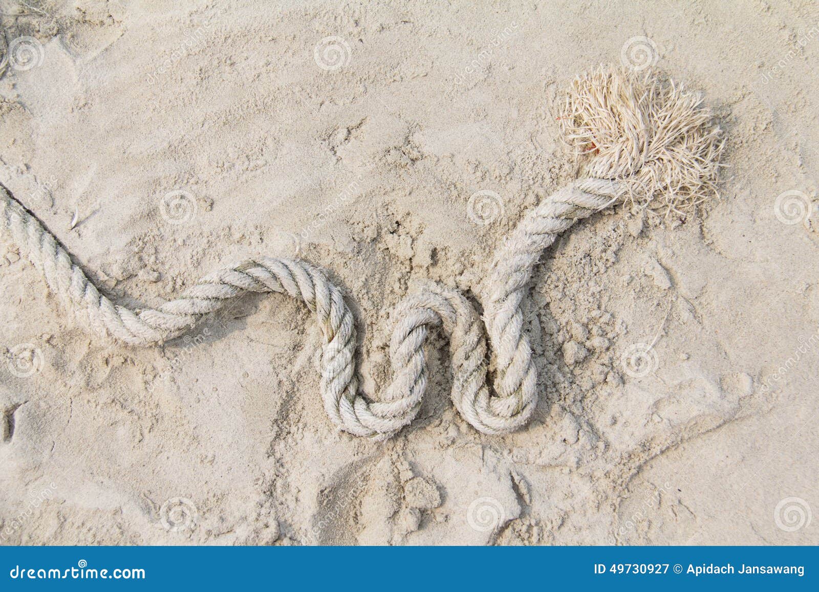 Rope on sand background stock image. Image of grainy 49730927