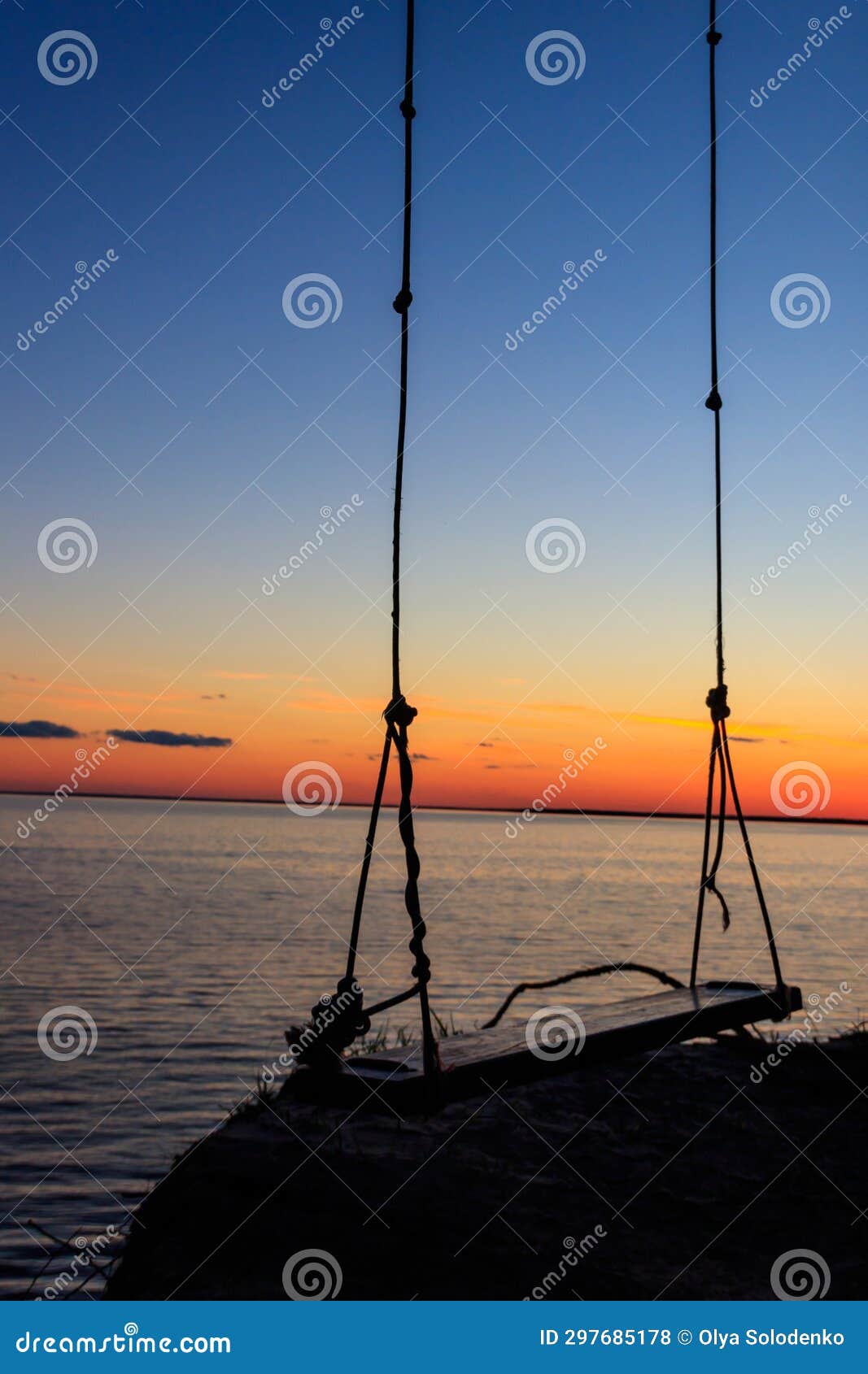 Rope Swing on Shore of the Dnieper River in Ukraine at Sunset Stock