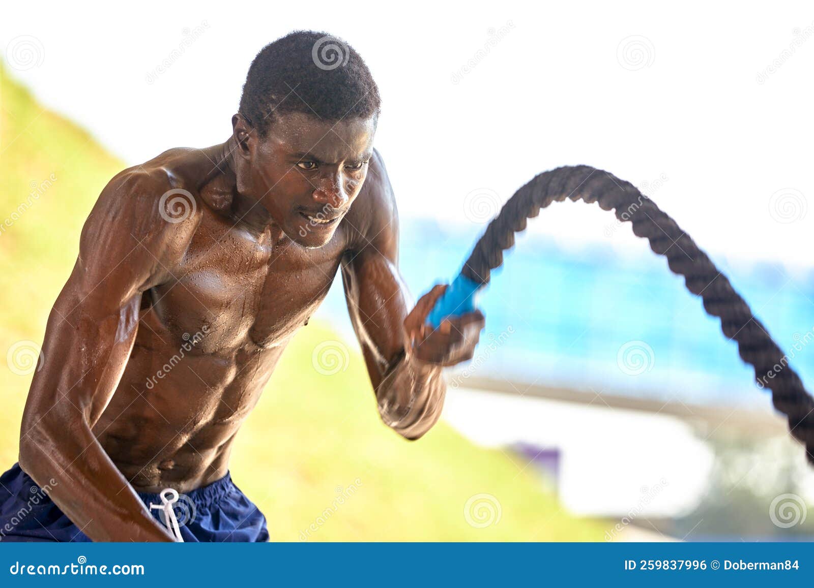 Rope Workout. Sport Man Doing Battle Ropes Exercise Outdoor Stock