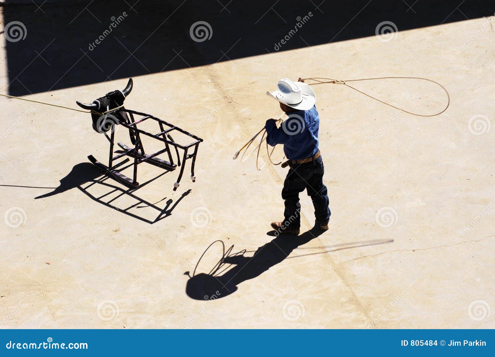 Roping practice. A young cowboy practicing his roping skills.